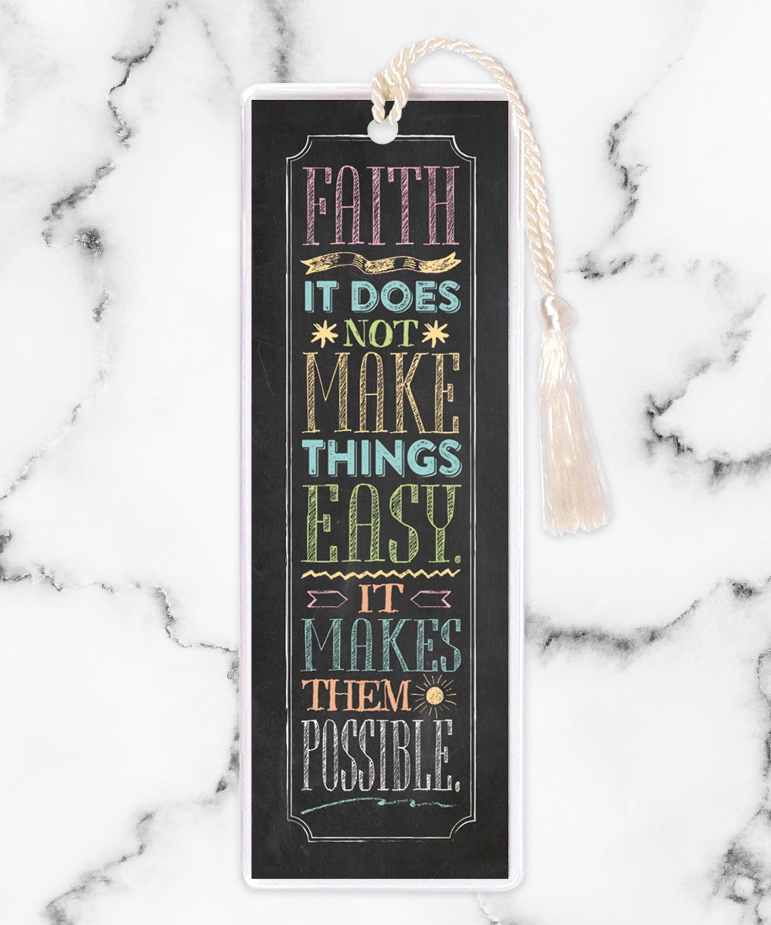 An elegant double-sided bookmark, Faith, is protected by a clear vinyl sleeve and finished with a tassel.