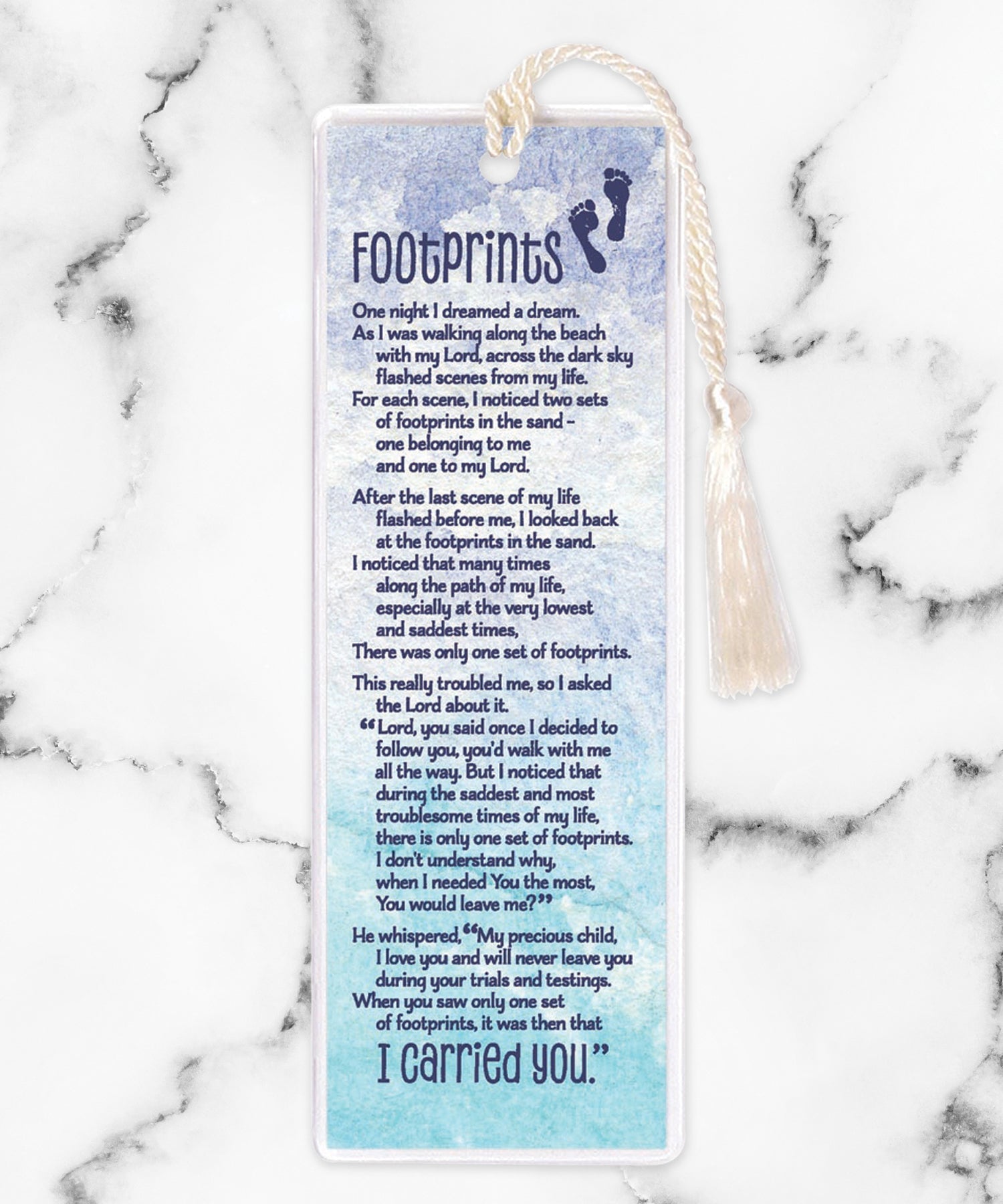 An elegant double-sided bookmark, Footprints, is protected by a clear vinyl sleeve and finished with a tassel.