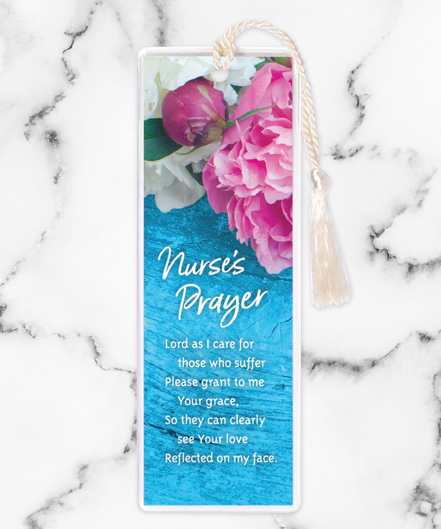 An elegant double-sided bookmark, Nurse's Prayer, is protected by a clear vinyl sleeve and finished with a tassel.