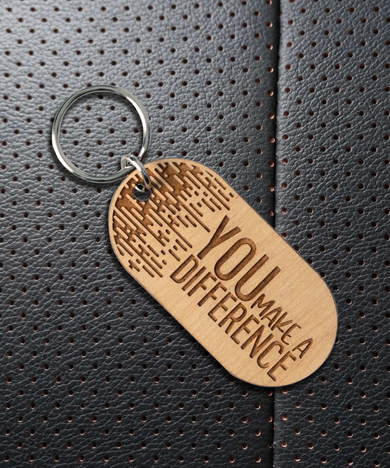 Natural maple wood keychains have a laser-cut shape and laser-engraved You Make a Difference inspirational verse.