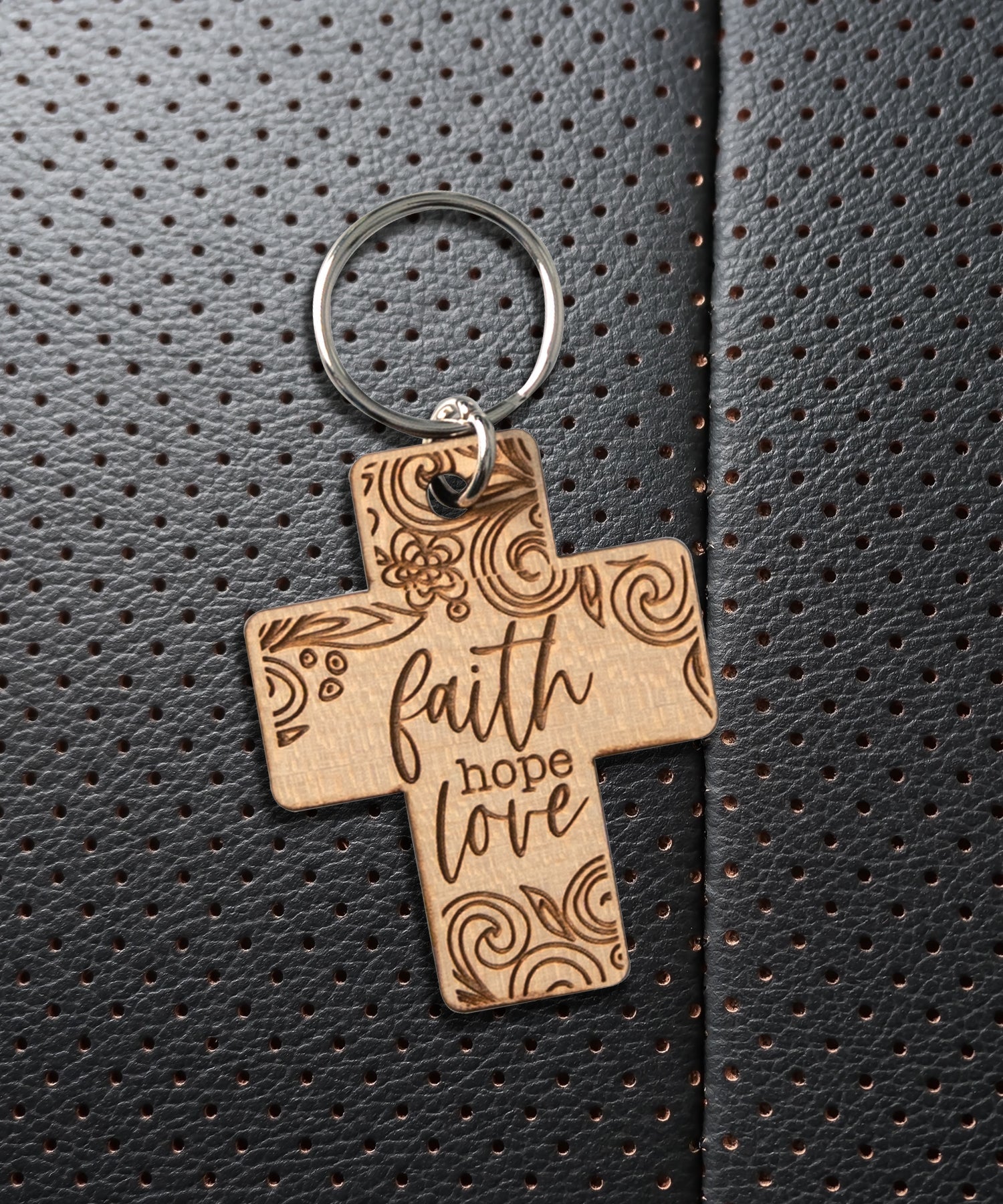 Natural maple wood keychains have a laser-cut shape and laser-engraved Faith Hope Love inspirational verse.