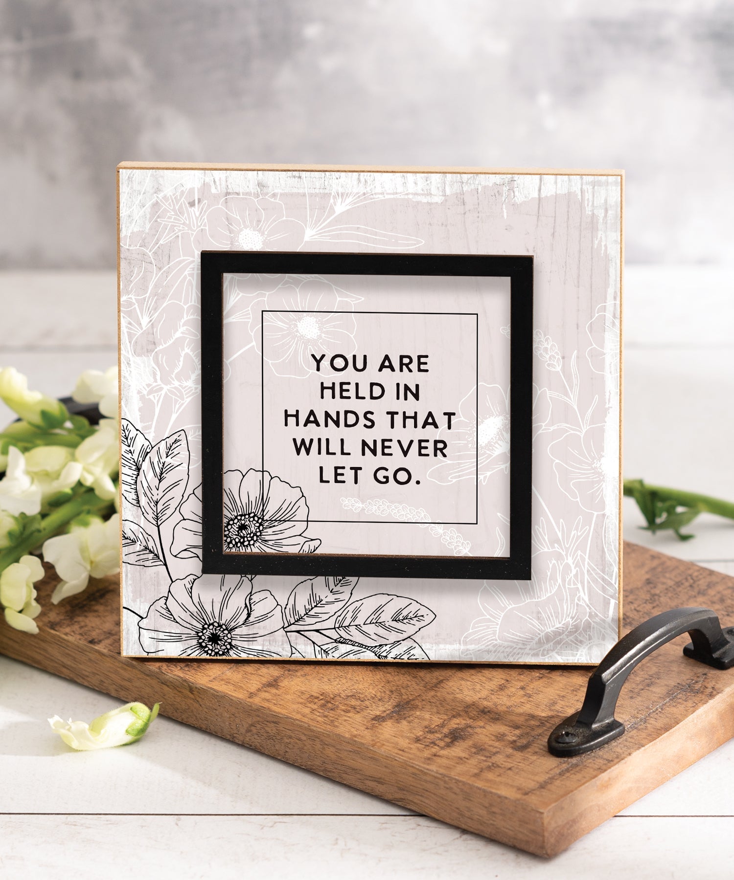 You Are Held in Hands 6x6 Layered Grace Plaque with laser-cut black accent, neutral modern artwork, and inspirational Christian message