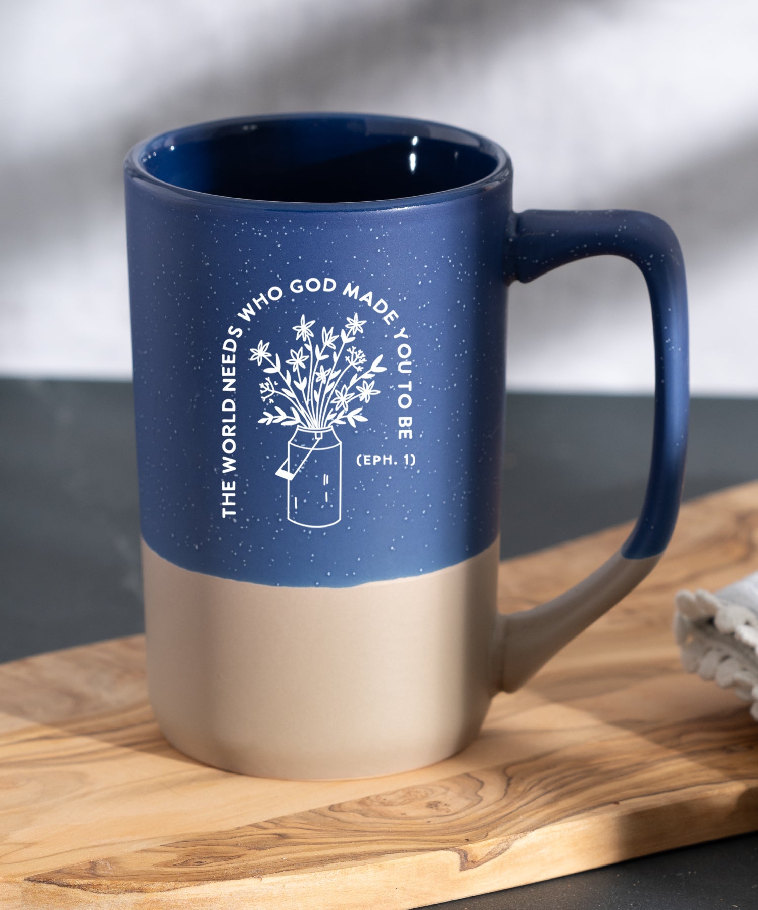 The World Needs You Pebble Mug with speckled two-tone design and inspirational Christian message