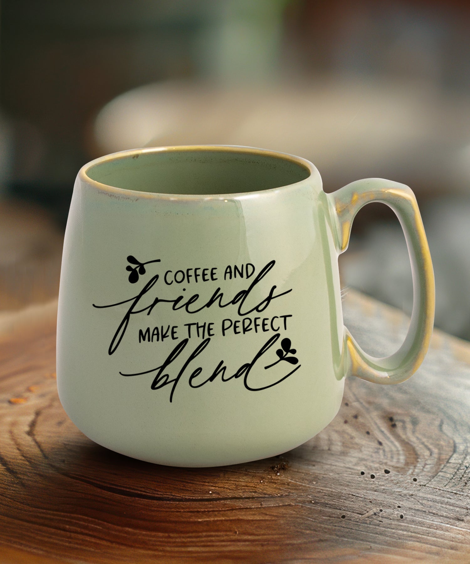 Ceramic mug with a broad base featuring Coffee and Friends.