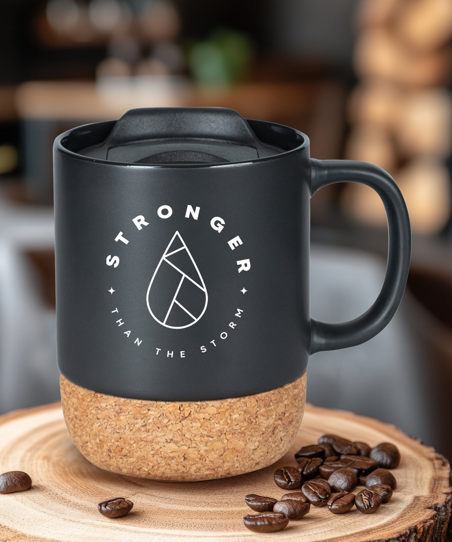 Cork bottom mug with a push-on, slide-locking lid featuring Stronger Than the Storm.