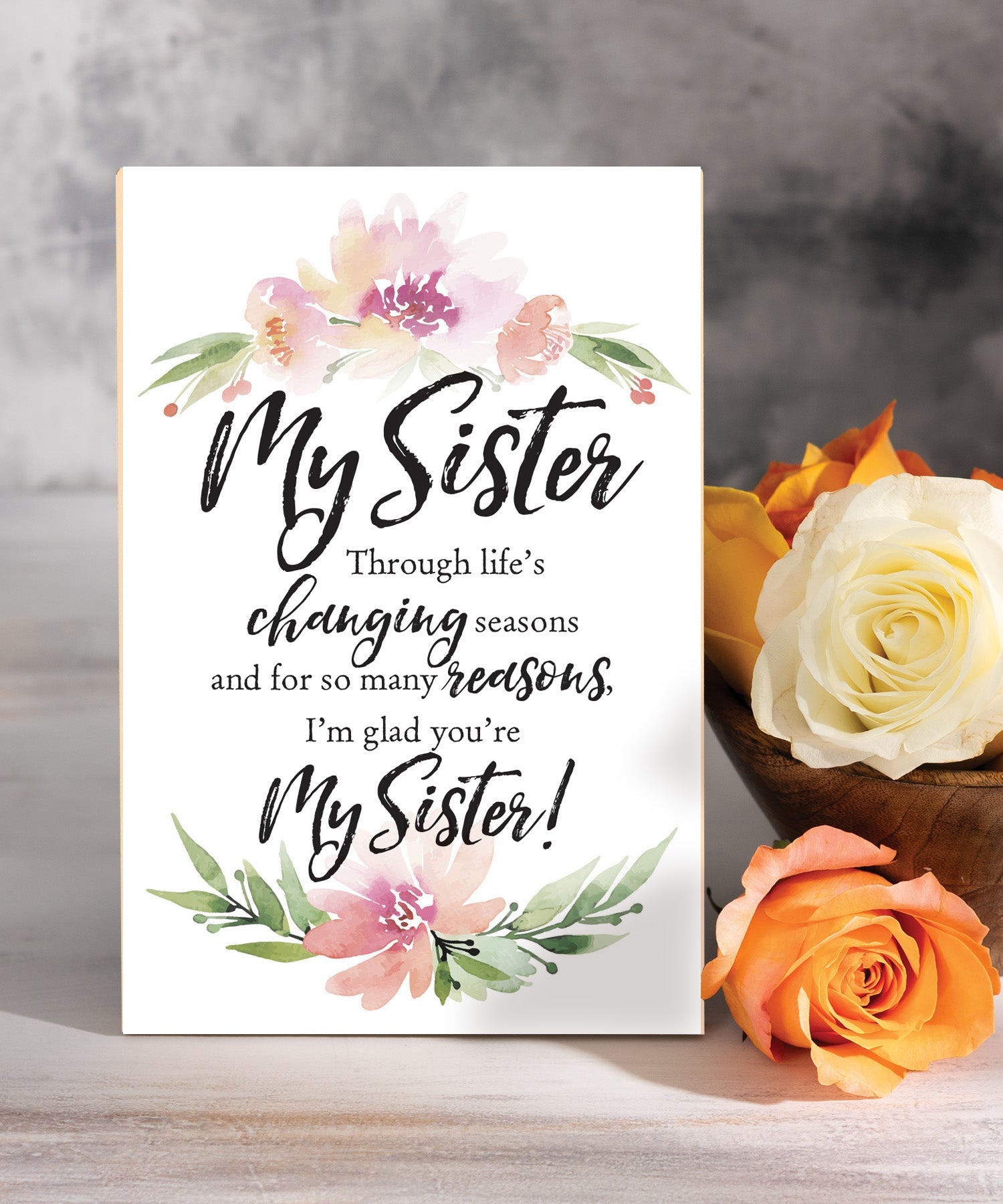 I’m Glad You’re My Sister 6x9 MDF plaque with inspirational sister message, pastel artwork, cream vinyl edge, easel back, and sentimental family verse