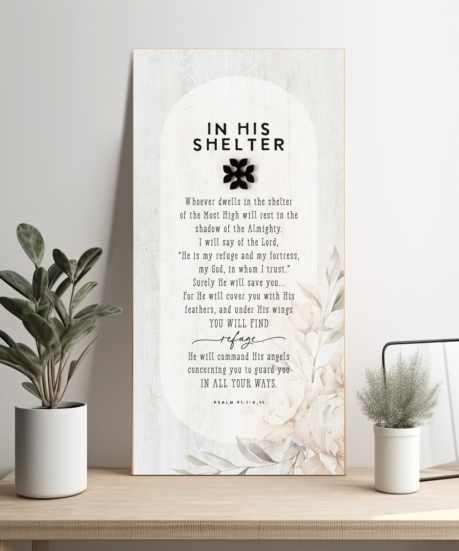 In His Shelter 6x13 MDF Statement Board with neutral-toned artwork, natural edge, farmhouse-style design, and a laser-cut black wood emblem accent under the title featuring an inspirational verse.
