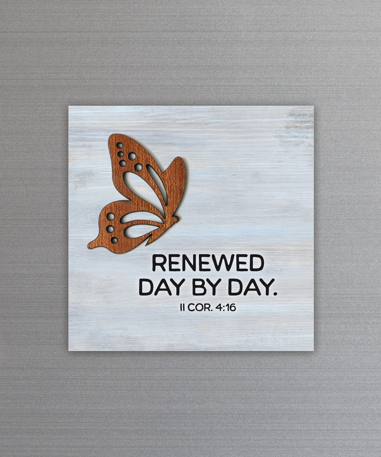 Renewed Day by Day magnet-plaque with laser-cut wooden butterfly and II Corinthians 4:16 verse on MDF