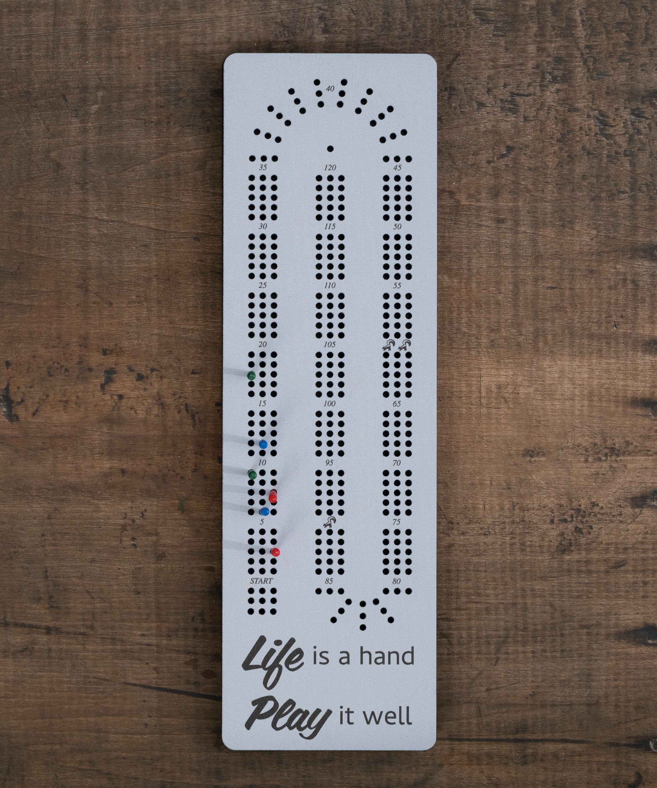 Life Is a Hand cribbage board with inspirational message and built-in peg storage, light purple design
