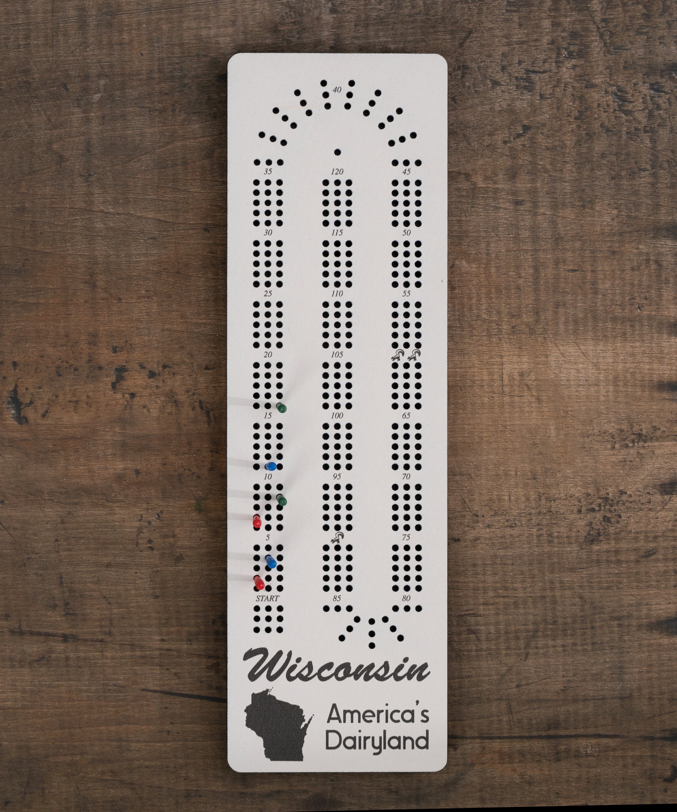 Wisconsin cribbage board with America’s Dairyland artwork and built-in peg storage
