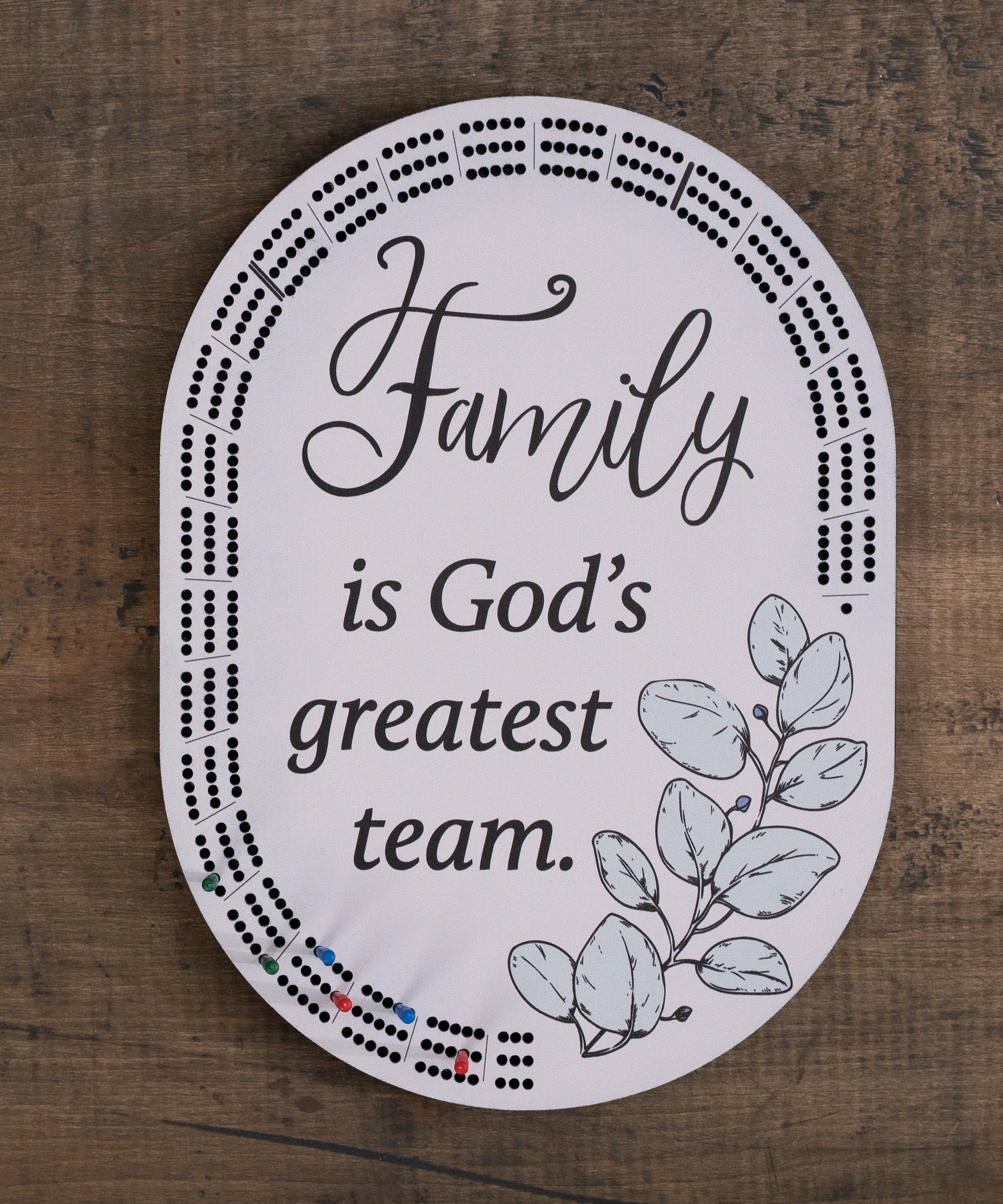 Family Is God’s Greatest Team cribbage board with inspirational verse, and built-in peg storage