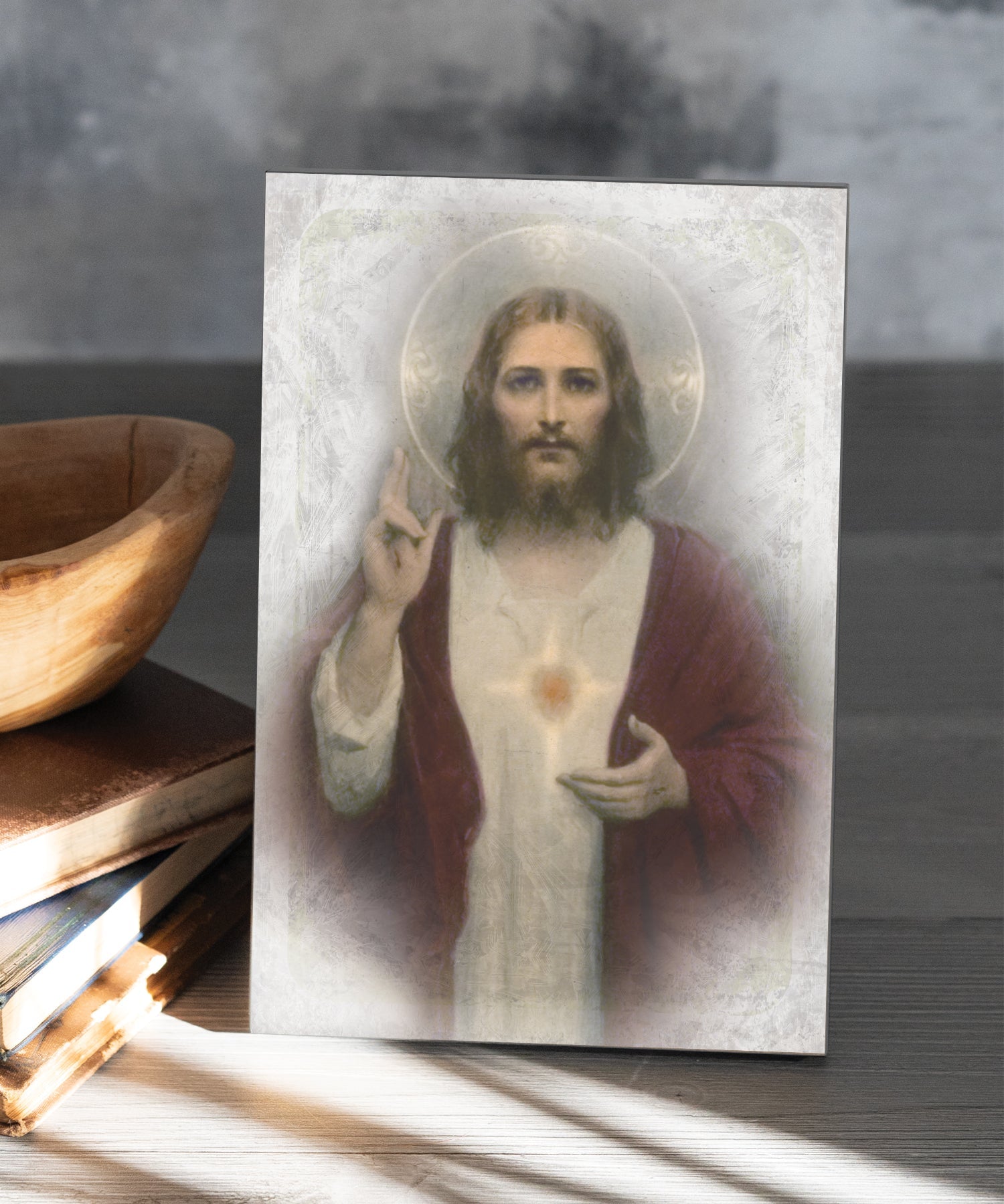 Sacred Heart 6x9 MDF Plaque has natural edges, muted tones, and inspirational imagery reflecting our faith in God. The plaque features full-color printing and a metal hanger and easel back.