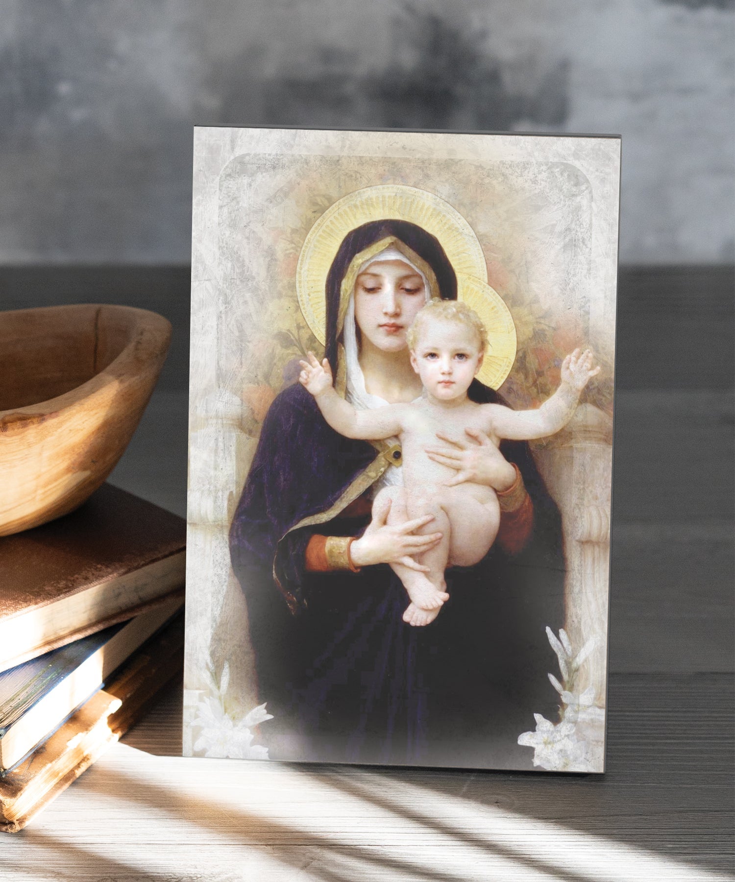 Madonna of the Lilies 6x9 MDF Plaque has natural edges, muted tones, and inspirational imagery reflecting our faith in God. The plaque features full-color printing and a metal hanger and easel back.