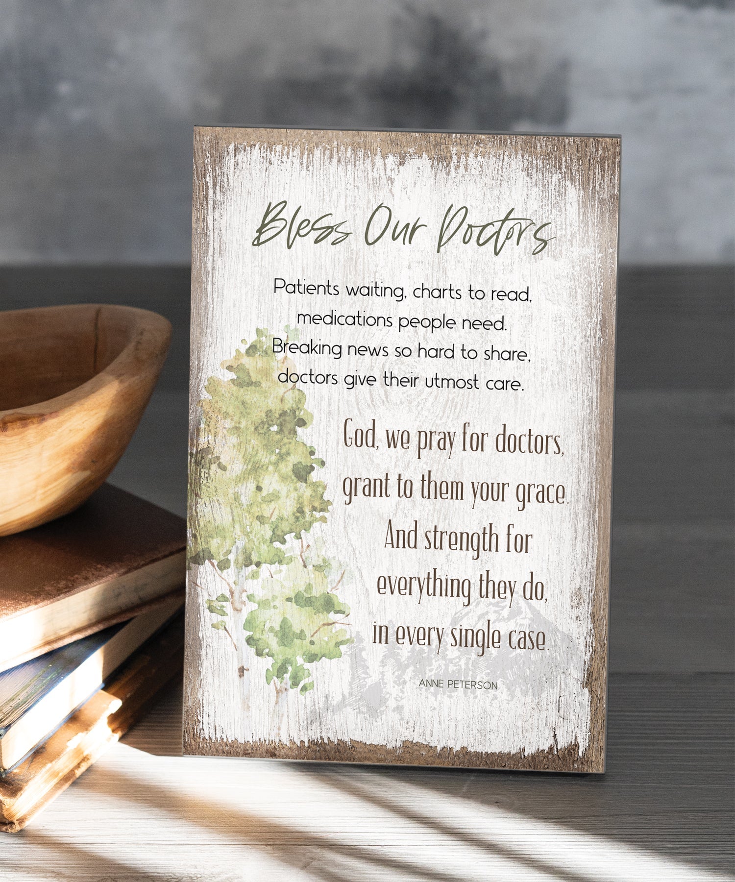 Bless Our Doctors 6x9 MDF Plaque has silver edges, inspirational verse, and a modern farmhouse style to fit any decor. The plaque features full-color printing and a metal hanger and easel back.