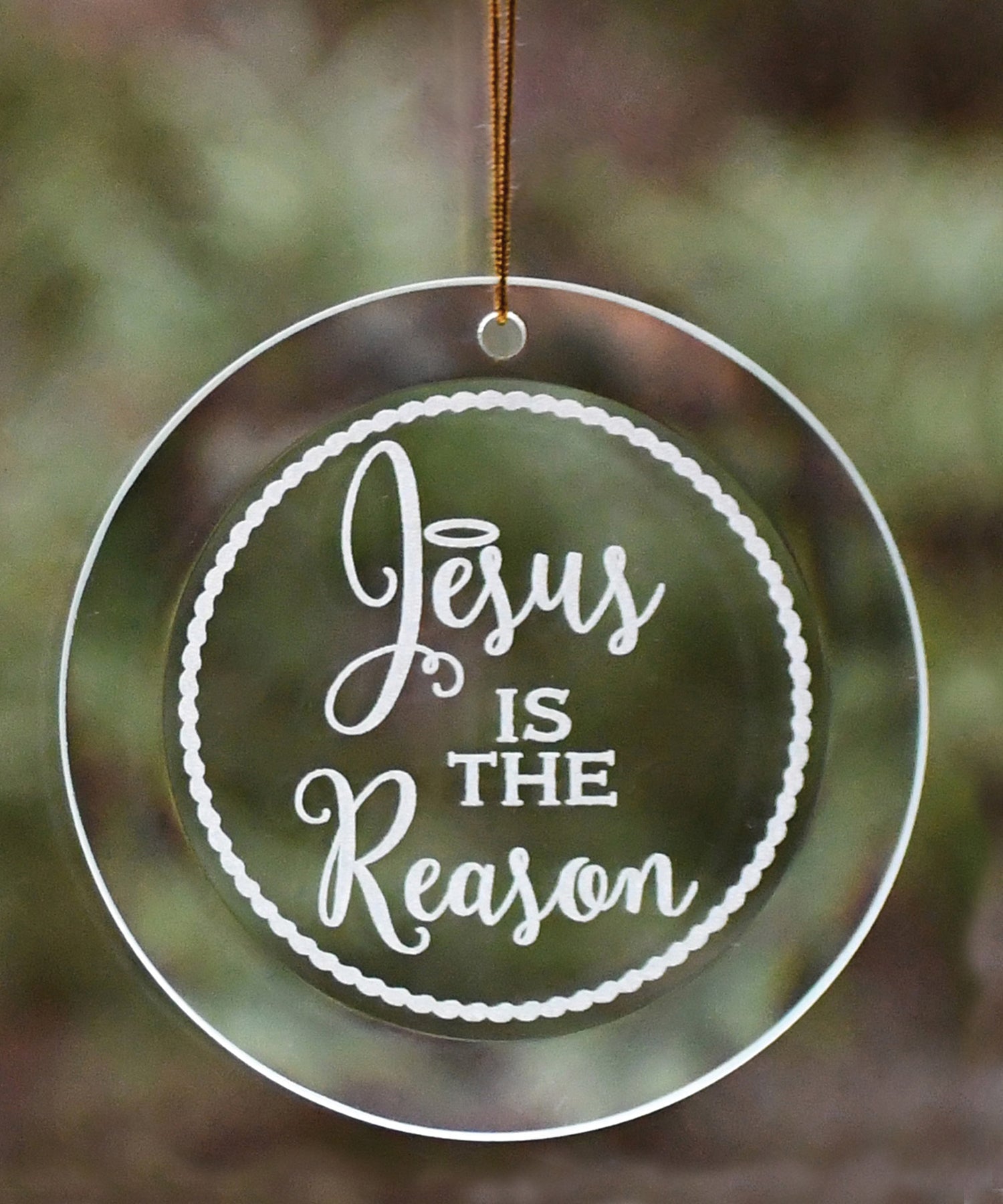 Jesus Is the Reason Ornament with laser-etched design and gold string hanger, perfect for Christmas décor