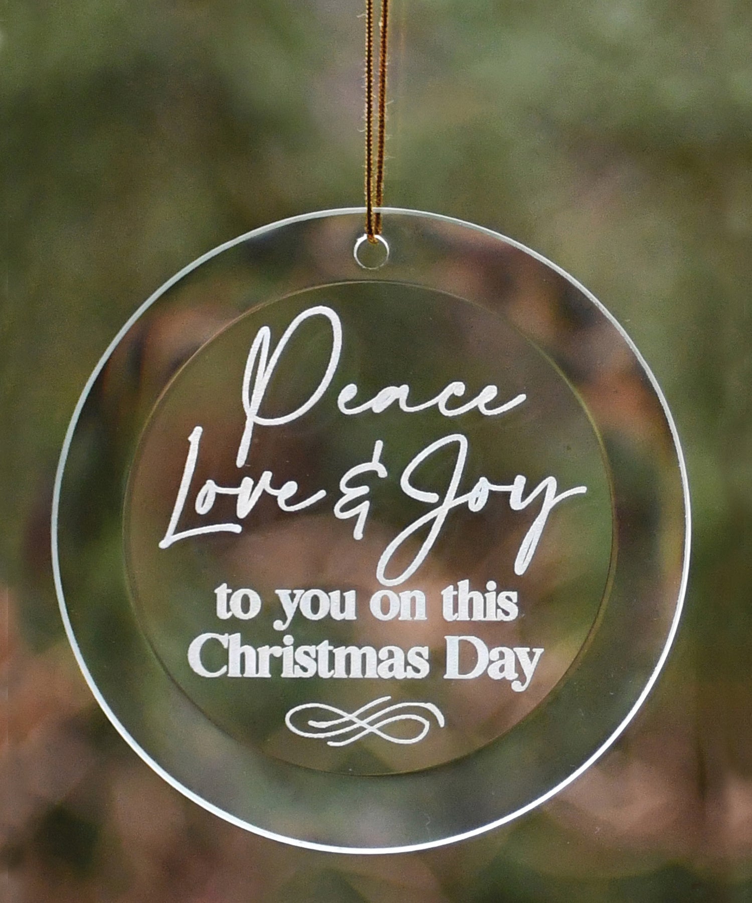Peace Love Joy Glass Ornament with laser-etched design and gold string hanger, perfect for Christmas décor