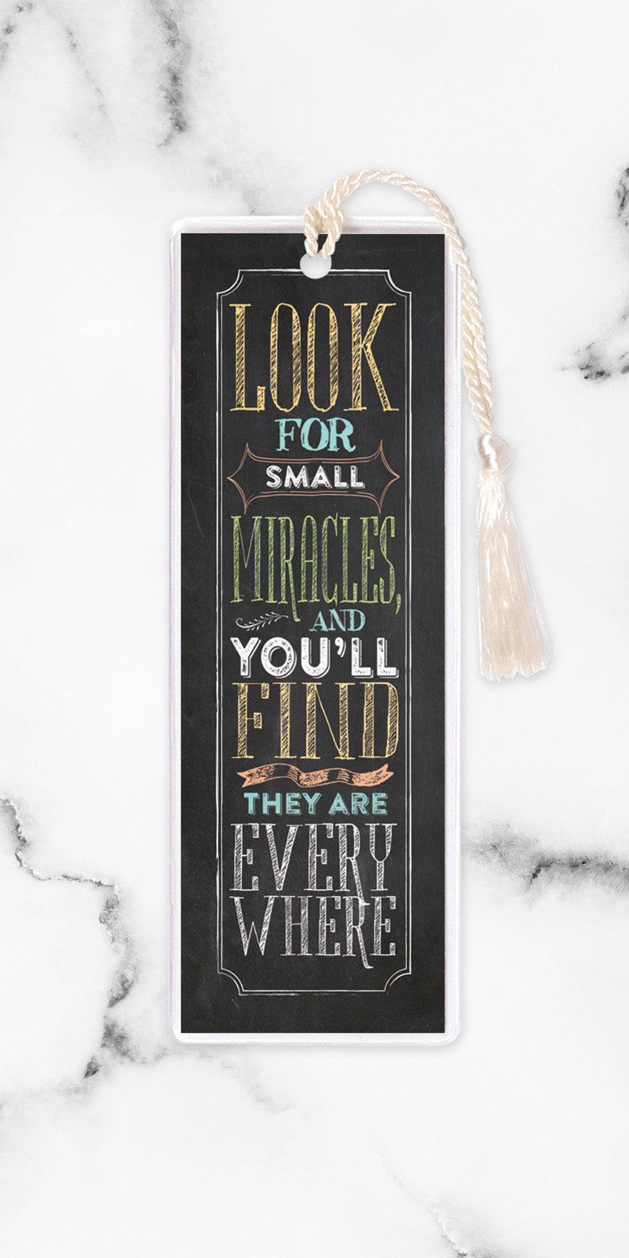 An elegant double-sided bookmark, Look For Small Miracles, is protected by a clear vinyl sleeve and finished with a tassel.