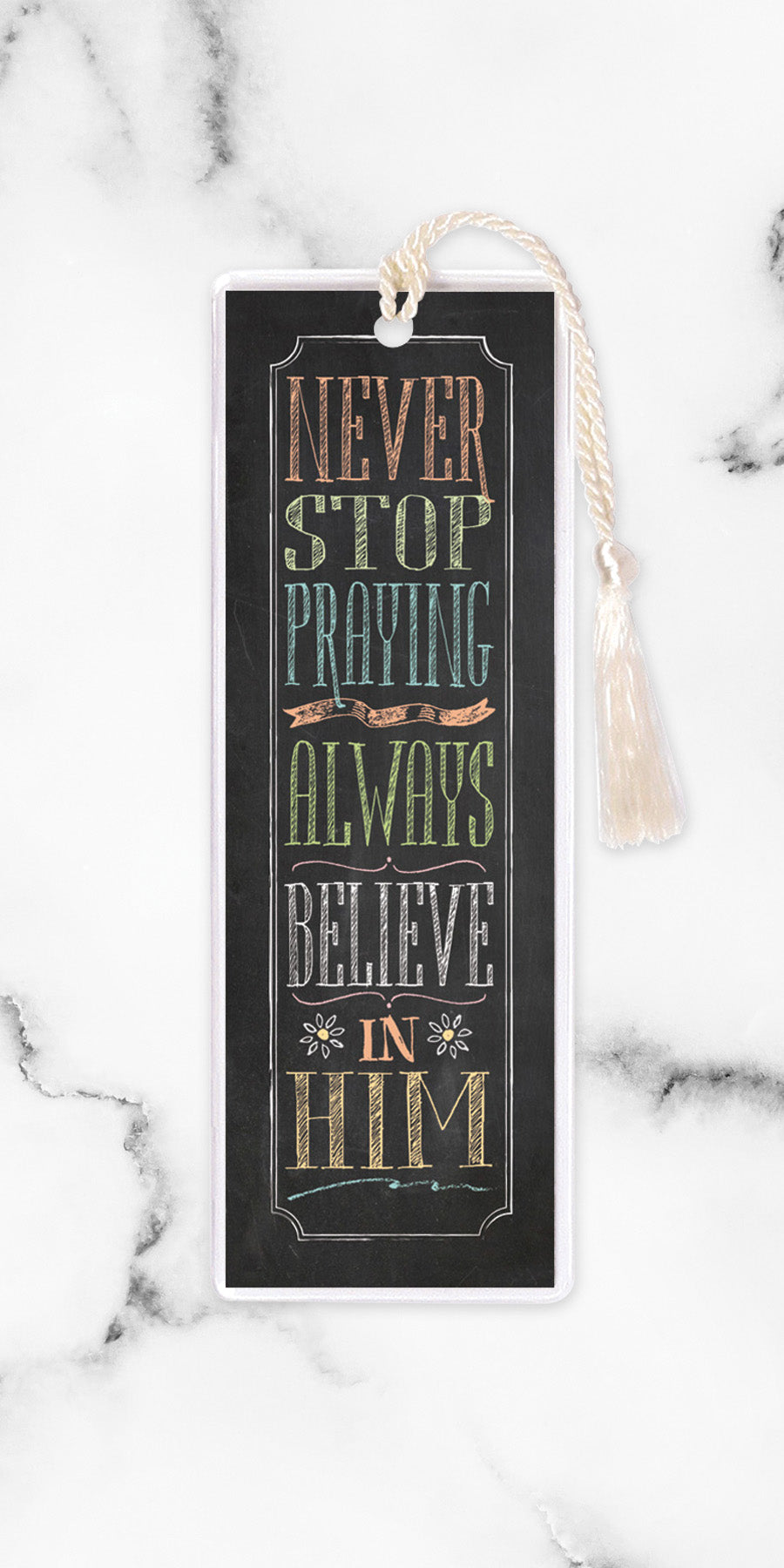 An elegant double-sided bookmark, Never Stop Praying, is protected by a clear vinyl sleeve and finished with a tassel.