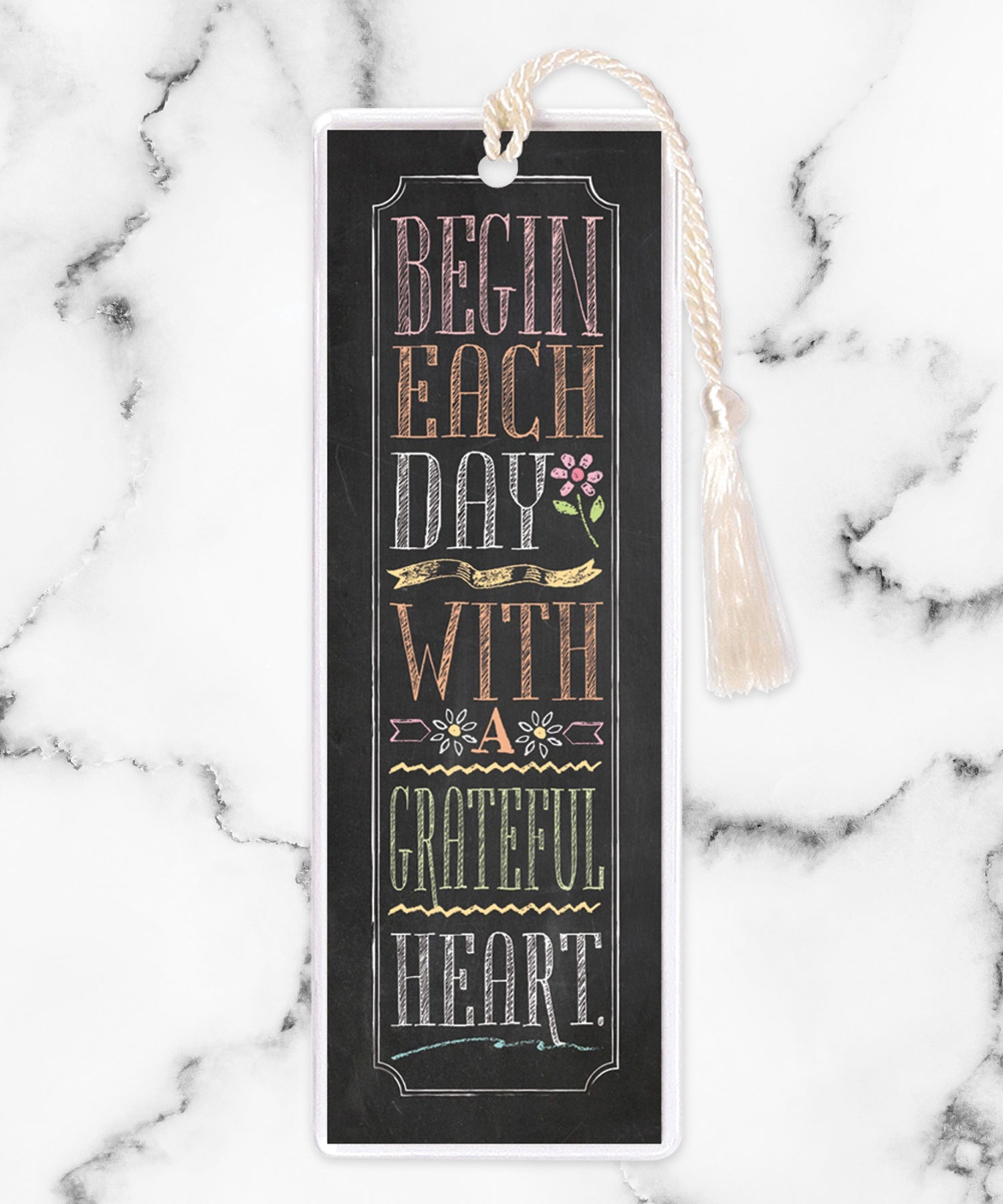 An elegant double-sided bookmark, Begin Each Day, is protected by a clear vinyl sleeve and finished with a tassel.