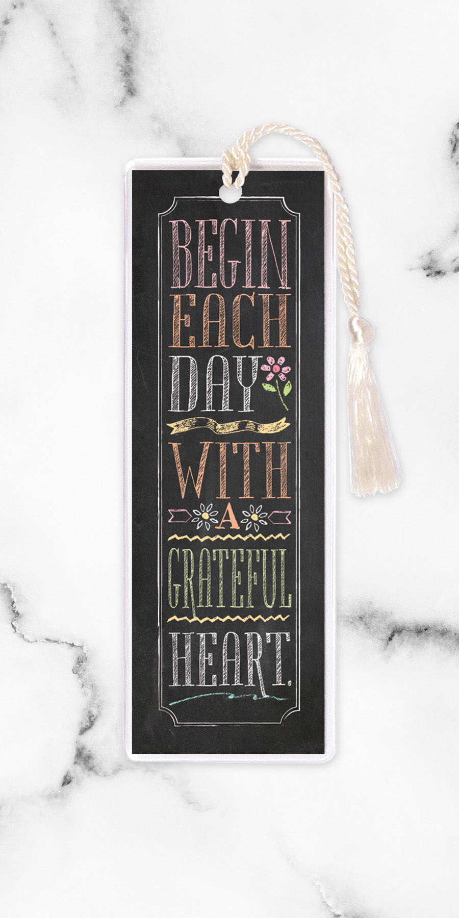 An elegant double-sided bookmark, Begin Each Day, is protected by a clear vinyl sleeve and finished with a tassel.