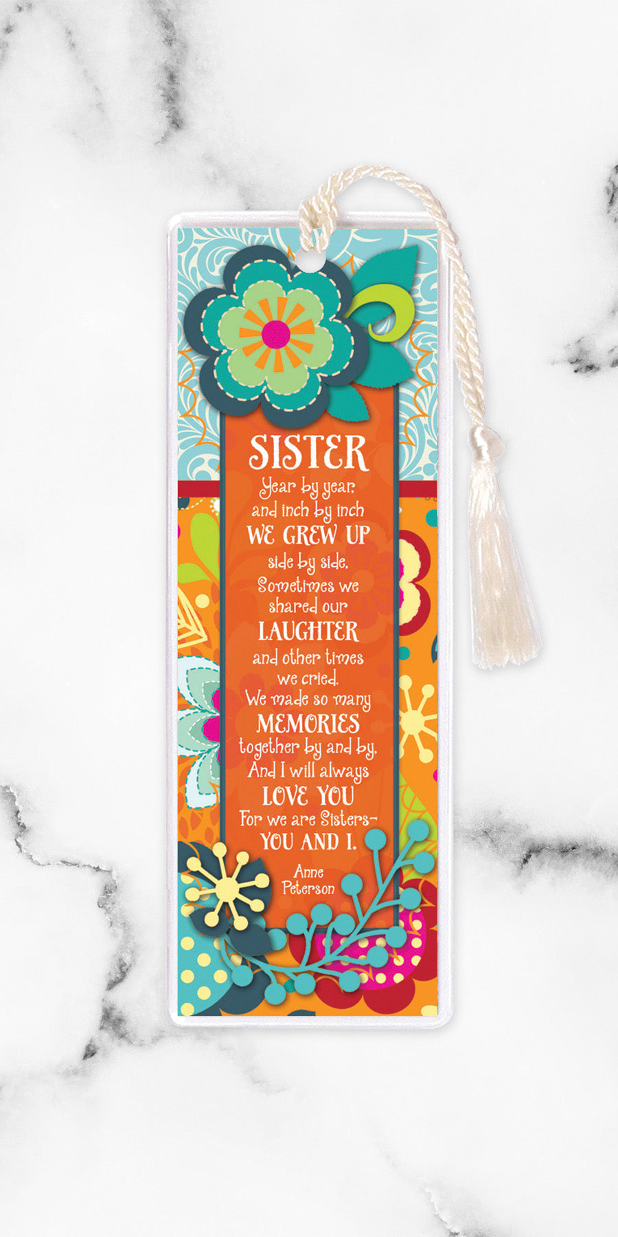 An elegant double-sided bookmark, Sister, is protected by a clear vinyl sleeve and finished with a tassel.
