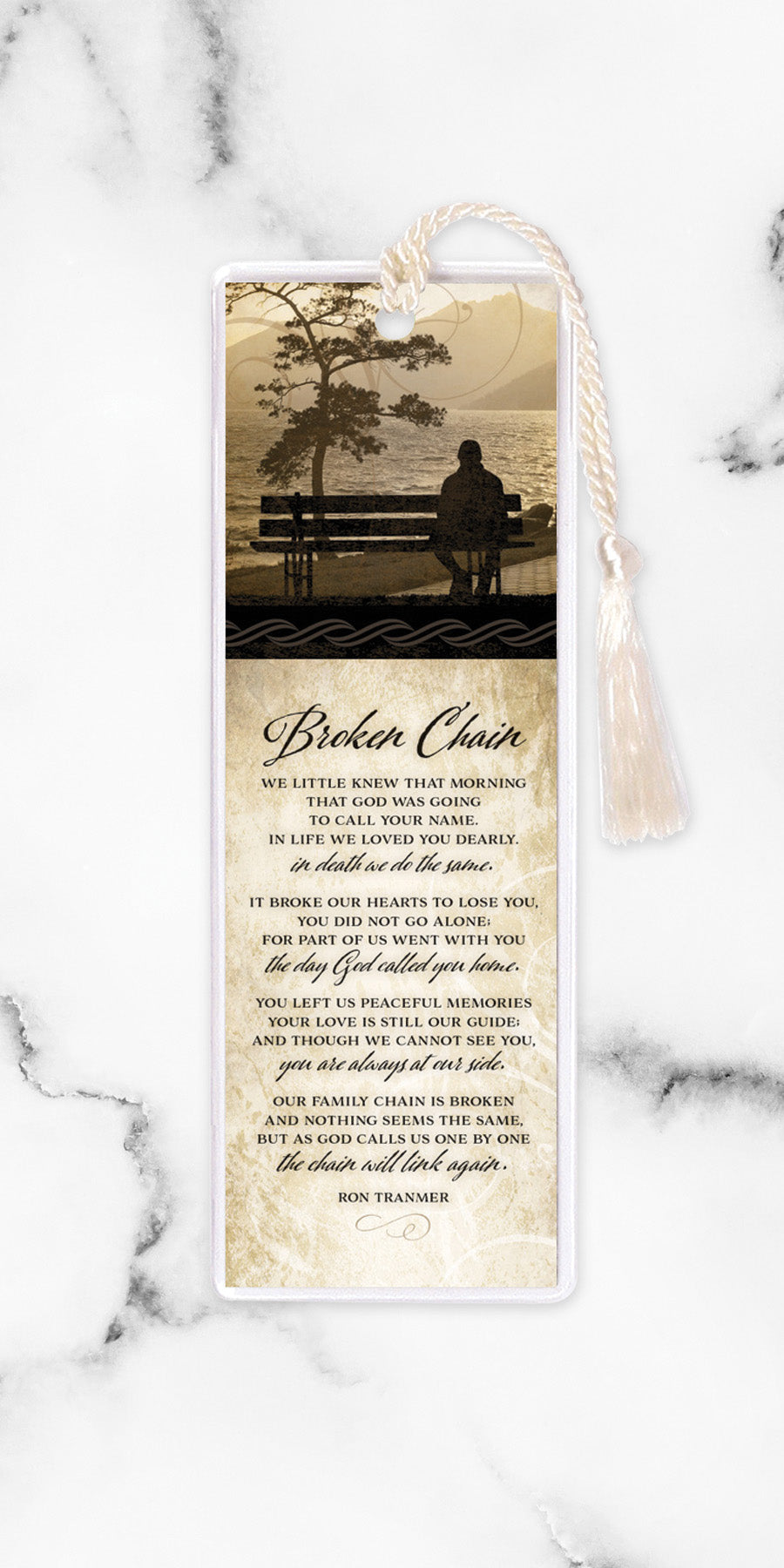 An elegant double-sided bookmark, Broken Chain, is protected by a clear vinyl sleeve and finished with a tassel.