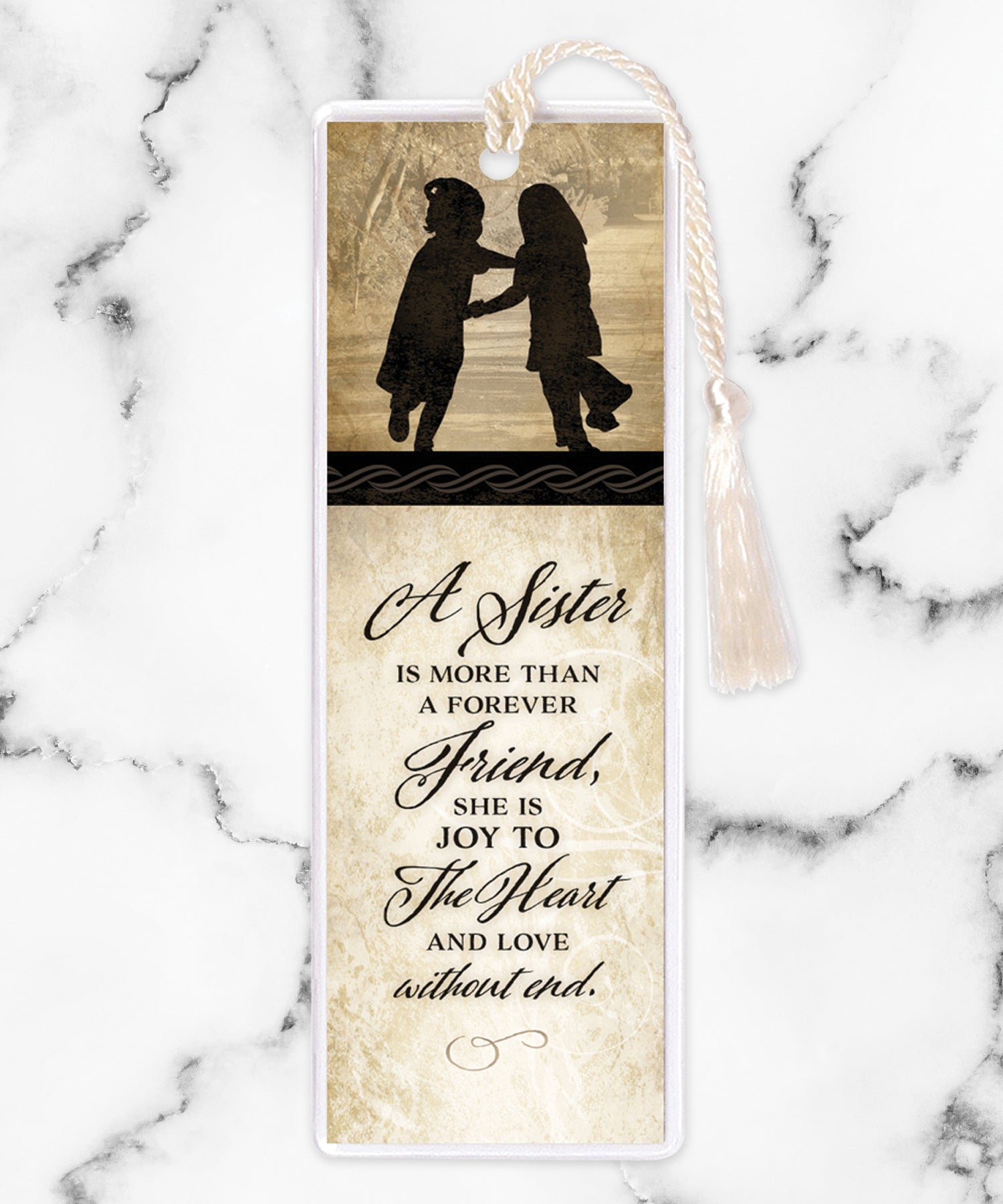 An elegant double-sided bookmark, Sister, is protected by a clear vinyl sleeve and finished with a tassel.