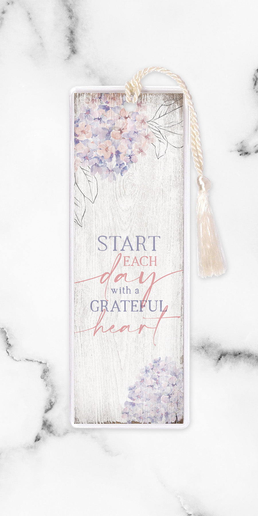 An elegant double-sided bookmark, Start Each Day, is protected by a clear vinyl sleeve and finished with a tassel.