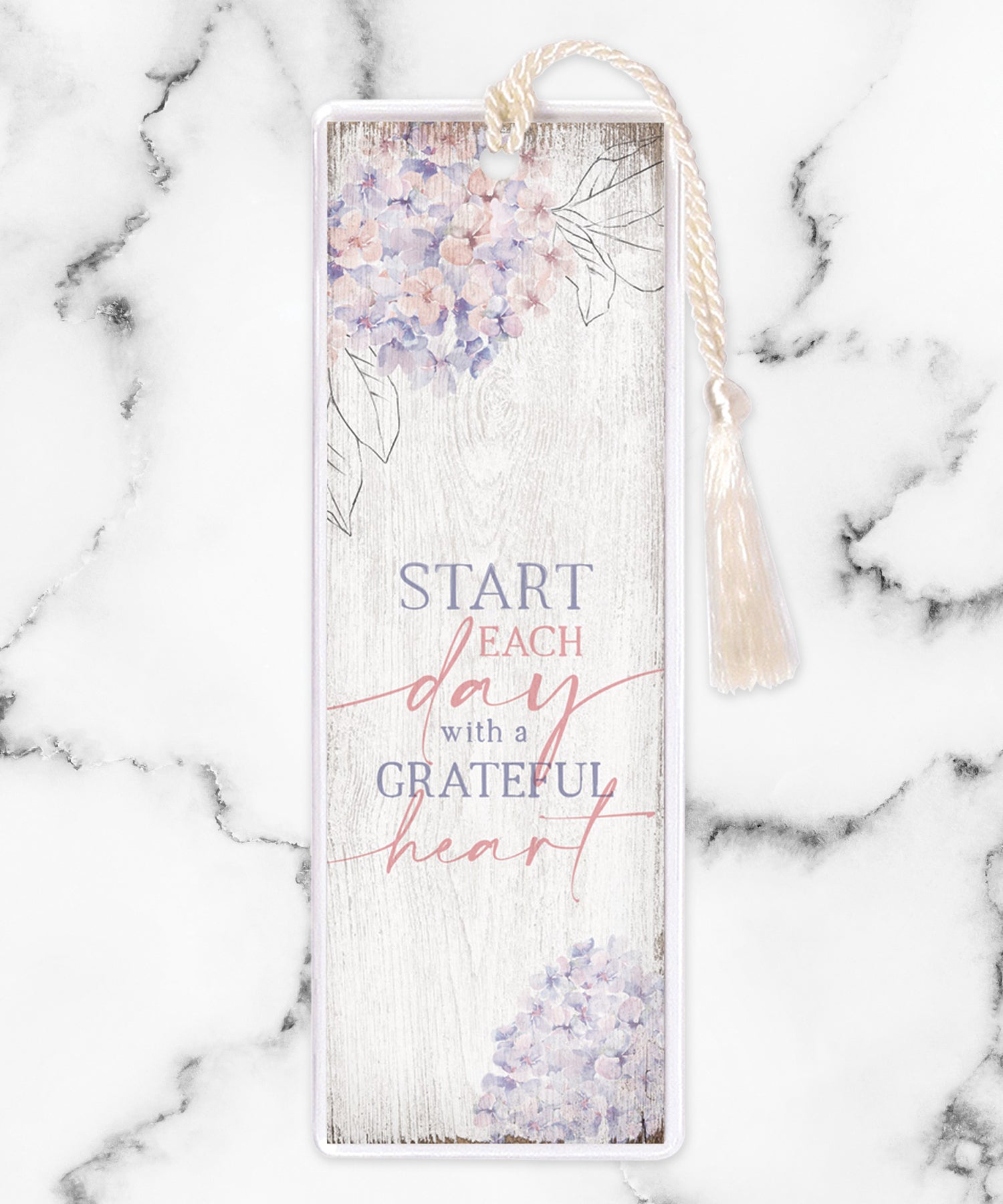 An elegant double-sided bookmark, Start Each Day, is protected by a clear vinyl sleeve and finished with a tassel.