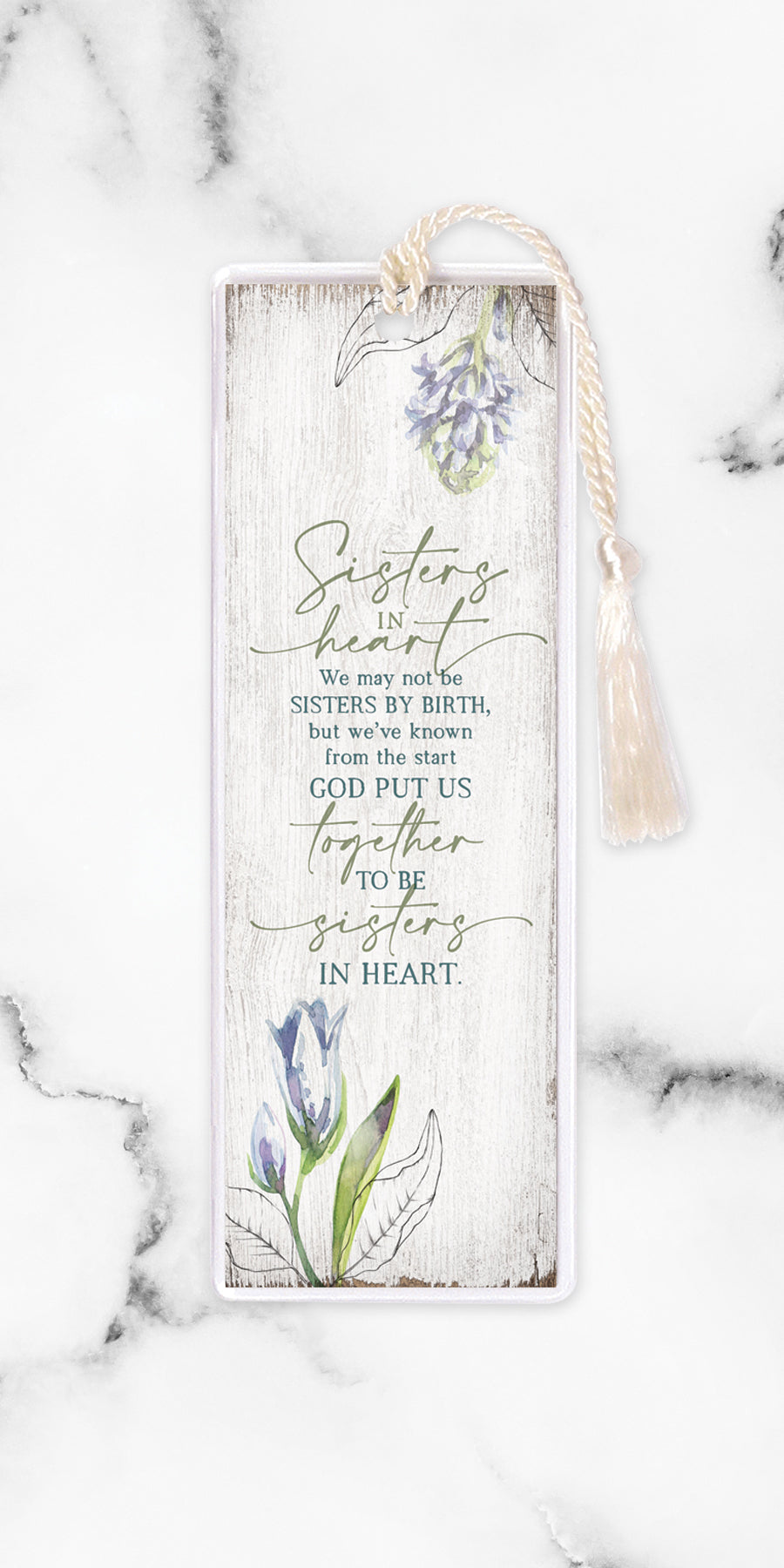 An elegant double-sided bookmark, Sisters In Heart, is protected by a clear vinyl sleeve and finished with a tassel.