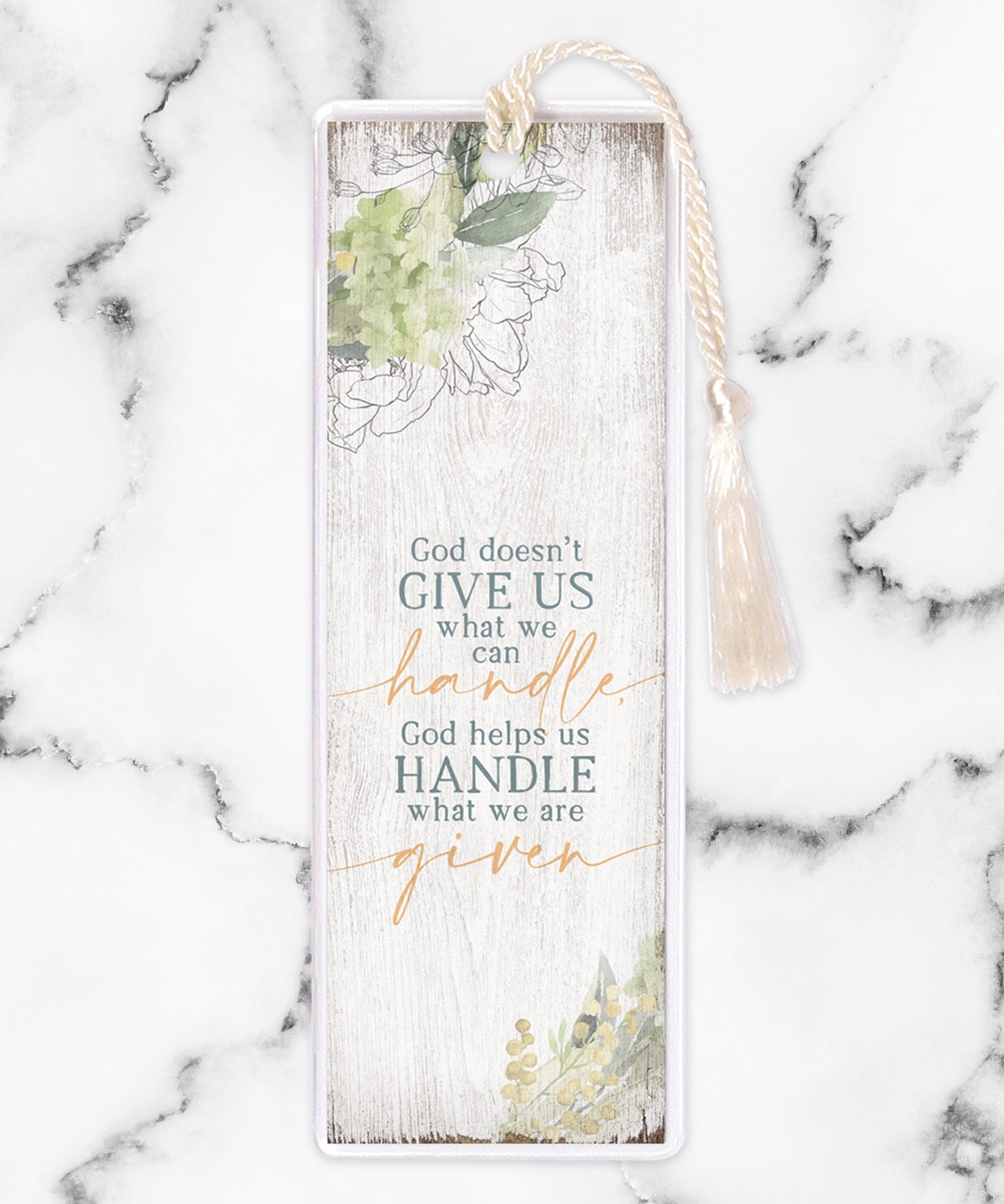 An elegant double-sided bookmark, God Doesn’t Give Us, is protected by a clear vinyl sleeve and finished with a tassel.