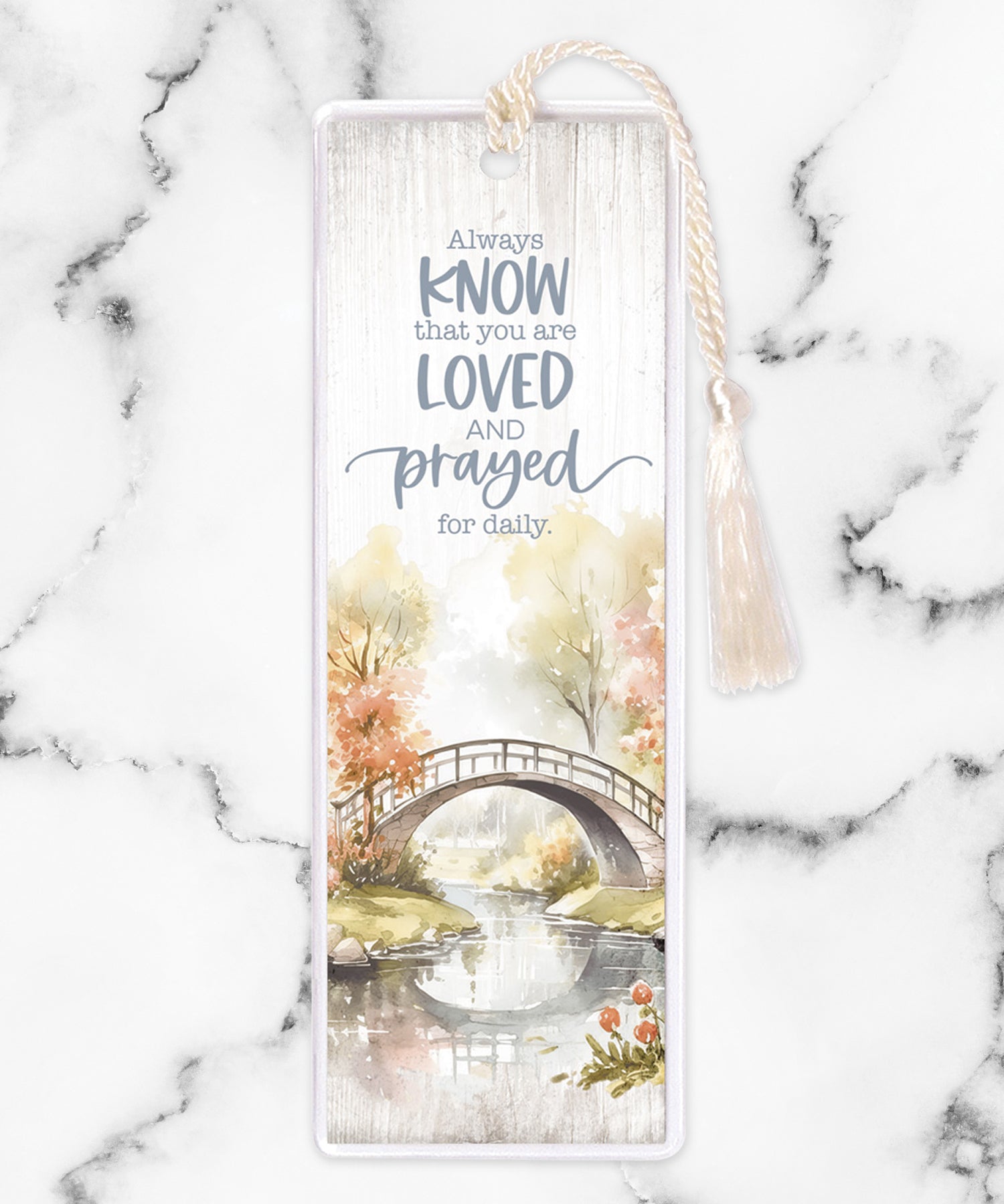 An elegant double-sided bookmark, Always Know, is protected by a clear vinyl sleeve and finished with a tassel.