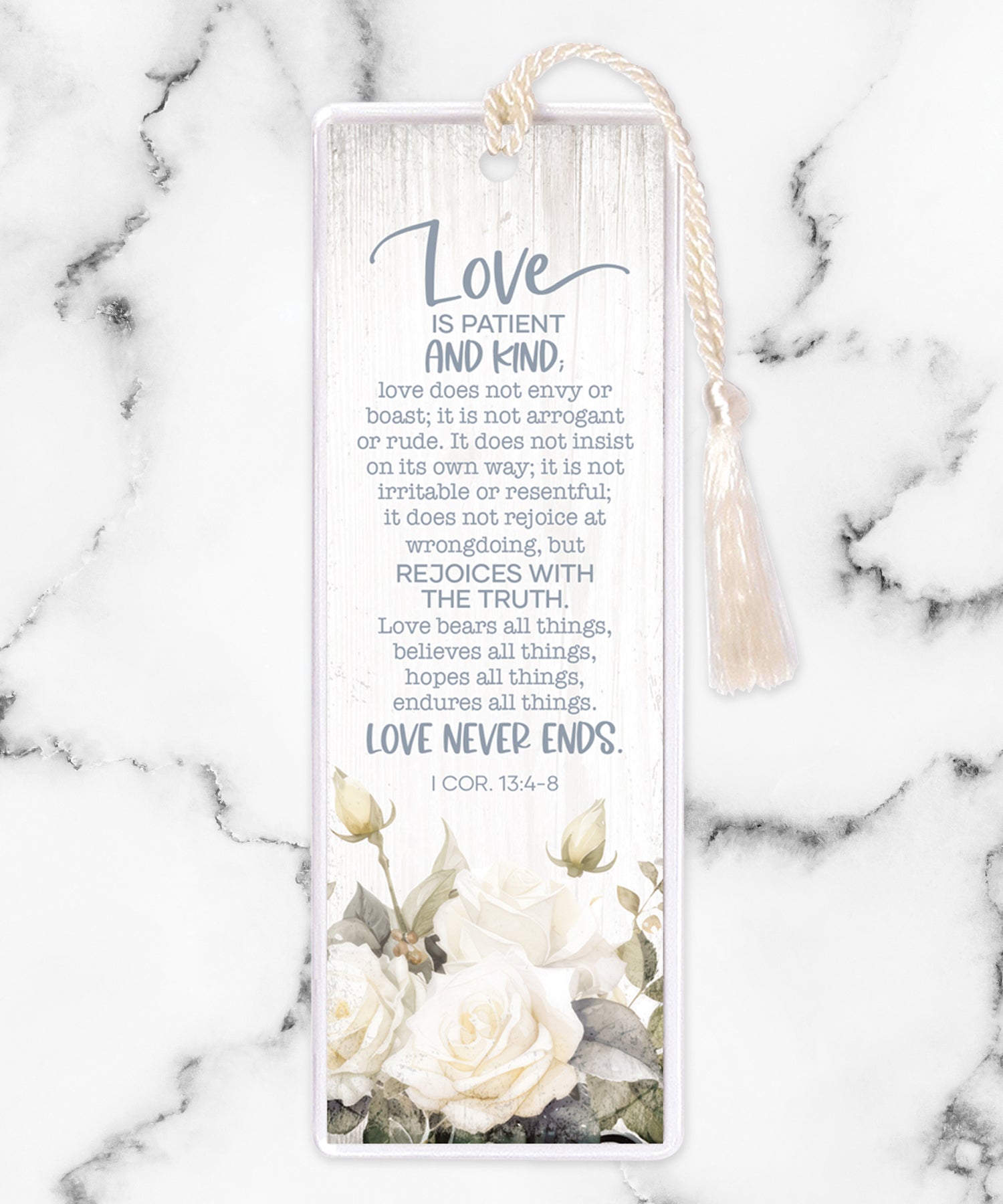 An elegant double-sided bookmark, Love is Patient, is protected by a clear vinyl sleeve and finished with a tassel.