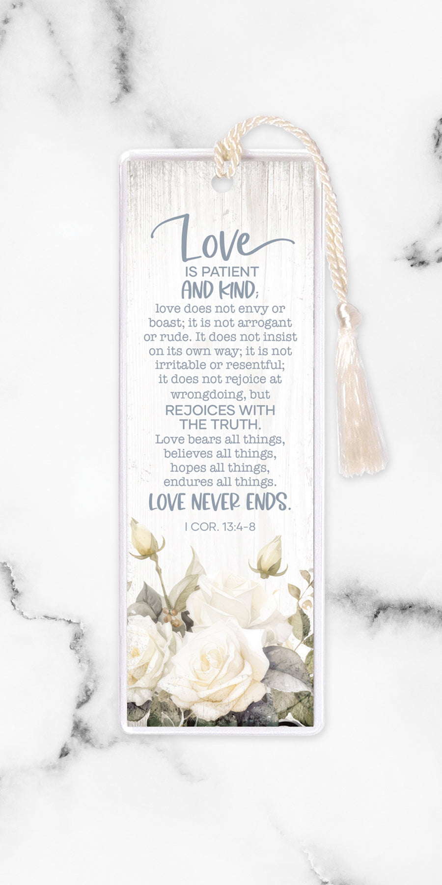 An elegant double-sided bookmark, Love is Patient, is protected by a clear vinyl sleeve and finished with a tassel.