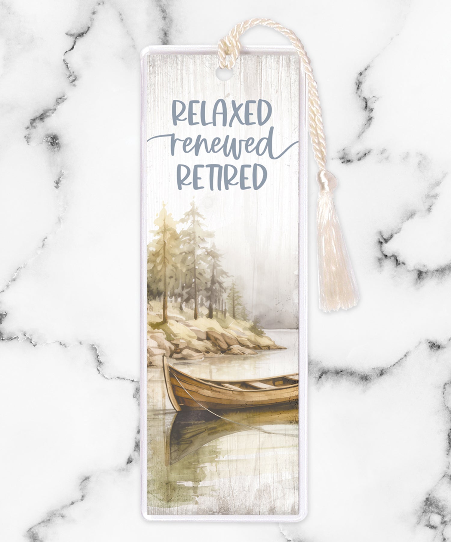 An elegant double-sided bookmark, Relaxed Renewed Retired, is protected by a clear vinyl sleeve and finished with a tassel.