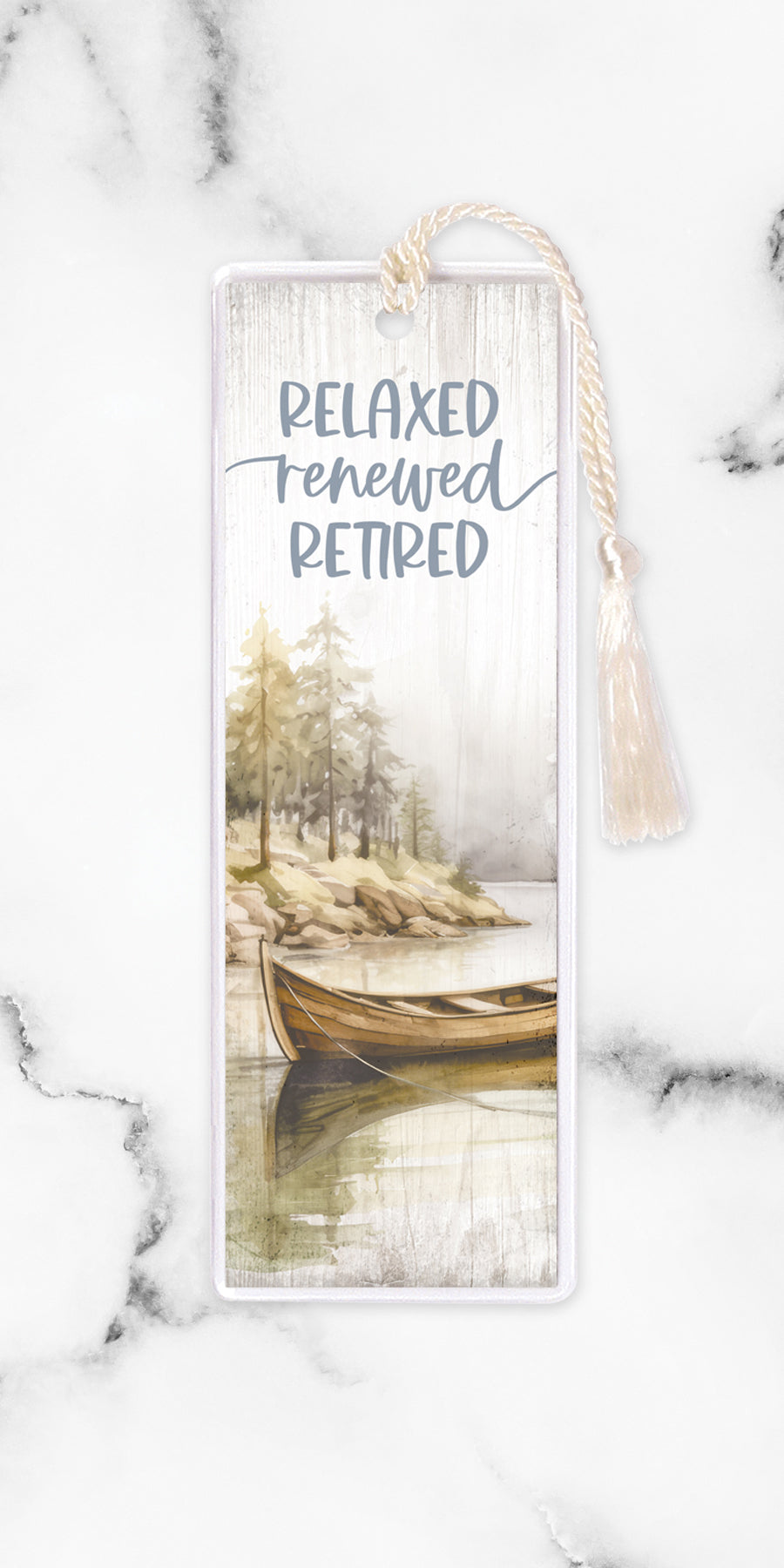 An elegant double-sided bookmark, Relaxed Renewed Retired, is protected by a clear vinyl sleeve and finished with a tassel.