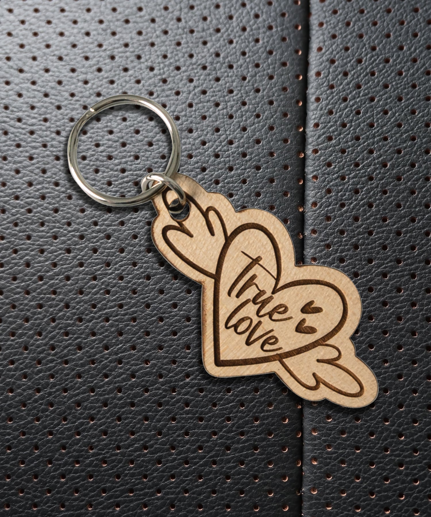 Natural maple wood keychains have a laser-cut shape and laser-engraved True Love inspirational verse.