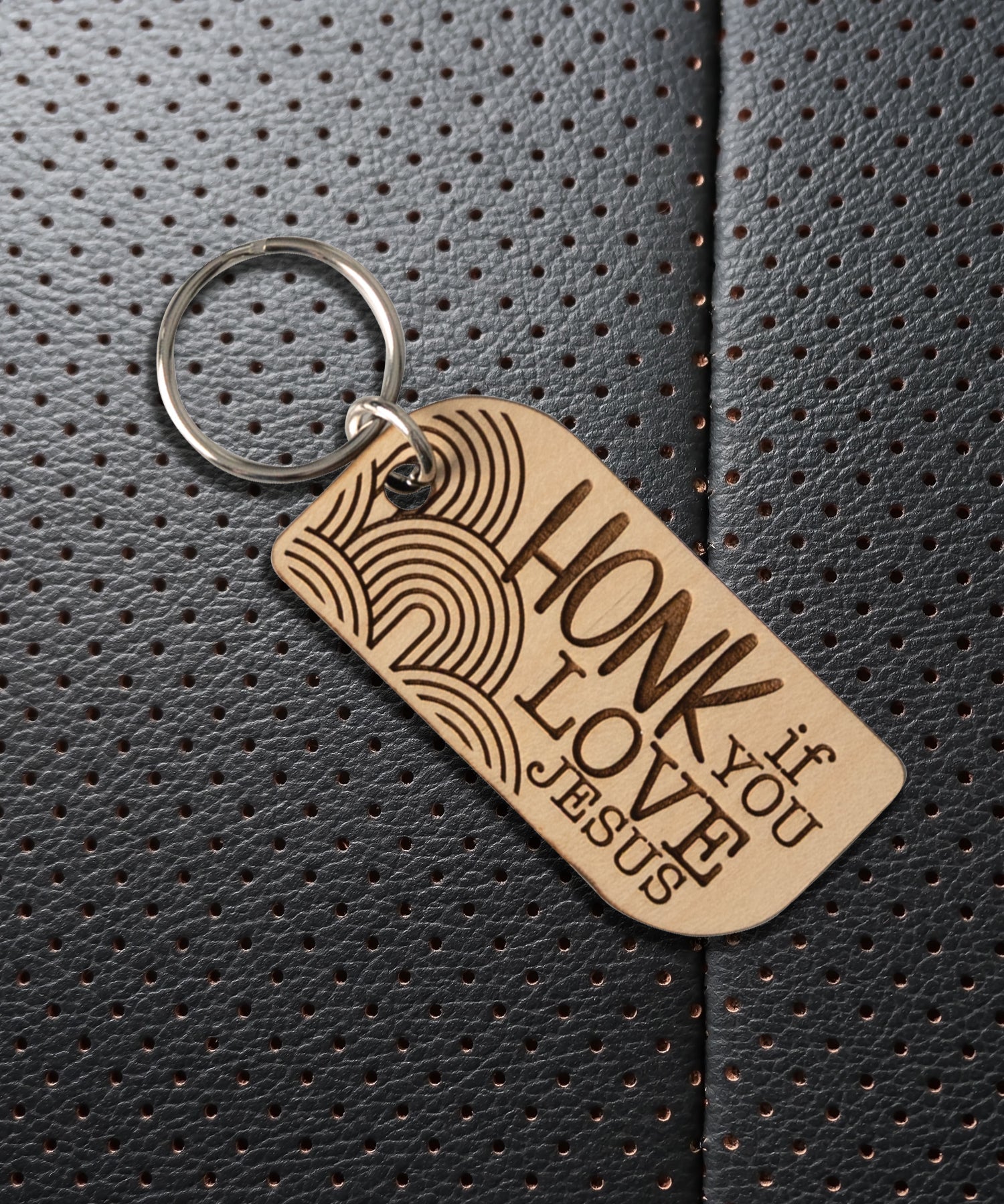 Natural maple wood keychains have a laser-cut shape and laser-engraved Honk if You Love Jesus inspirational verse.