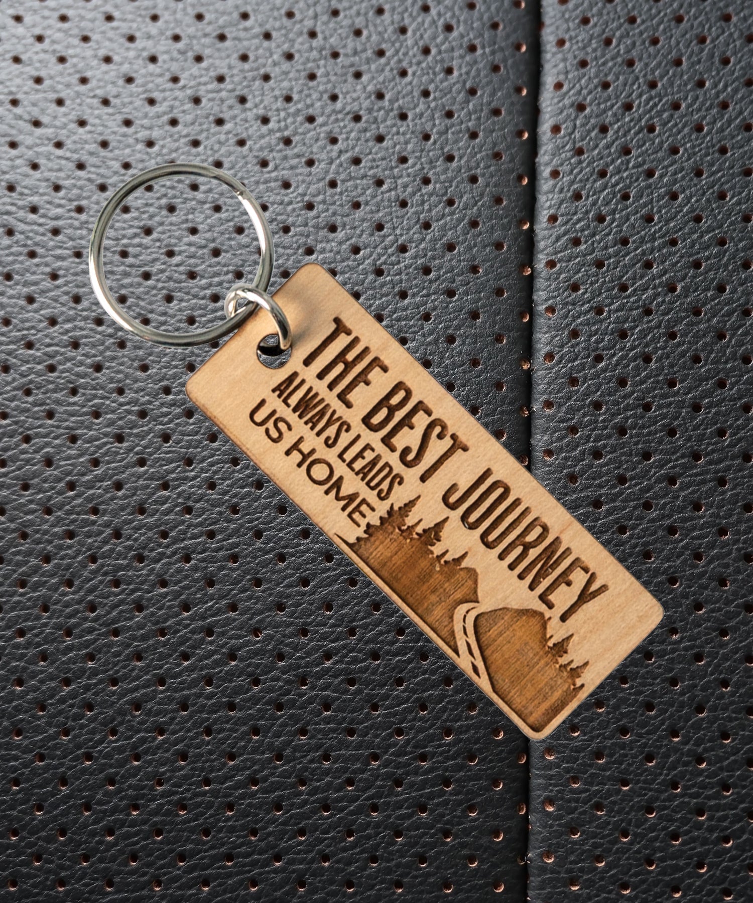 Natural maple wood keychains have a laser-cut shape and laser-engraved The Best Journey inspirational verse.