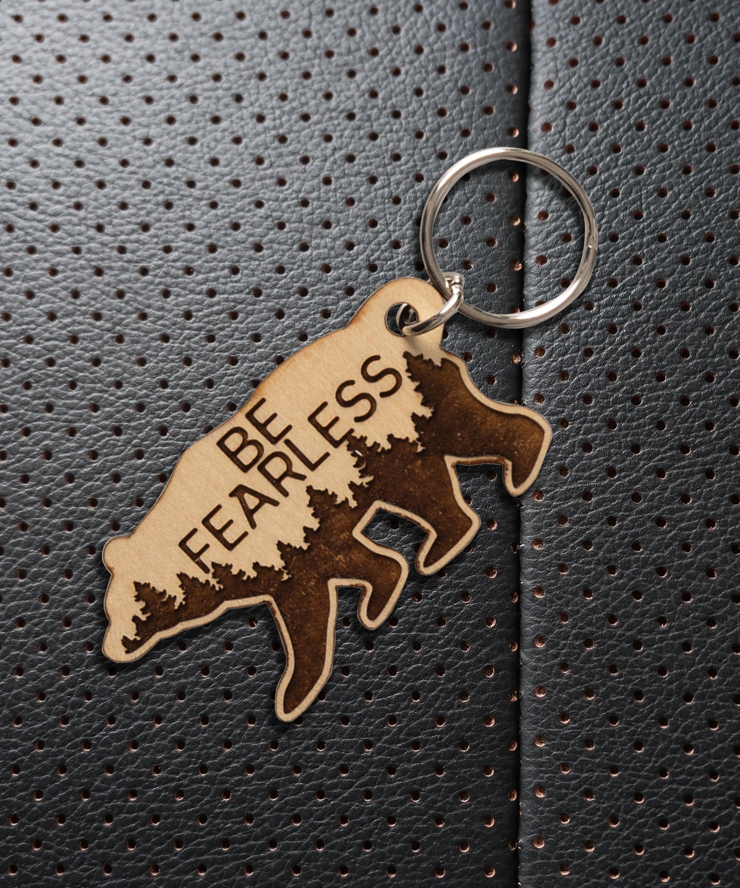 Natural maple wood keychains have a laser-cut shape and laser-engraved Be Fearless inspirational verse.
