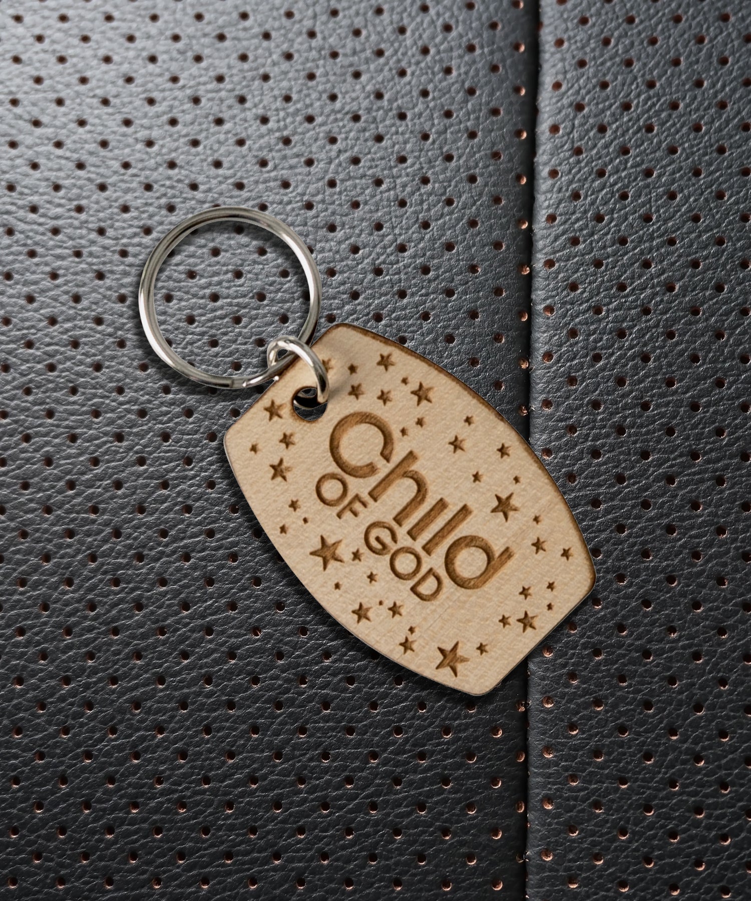 Natural maple wood keychains have a laser-cut shape and laser-engraved Child of God inspirational verse.