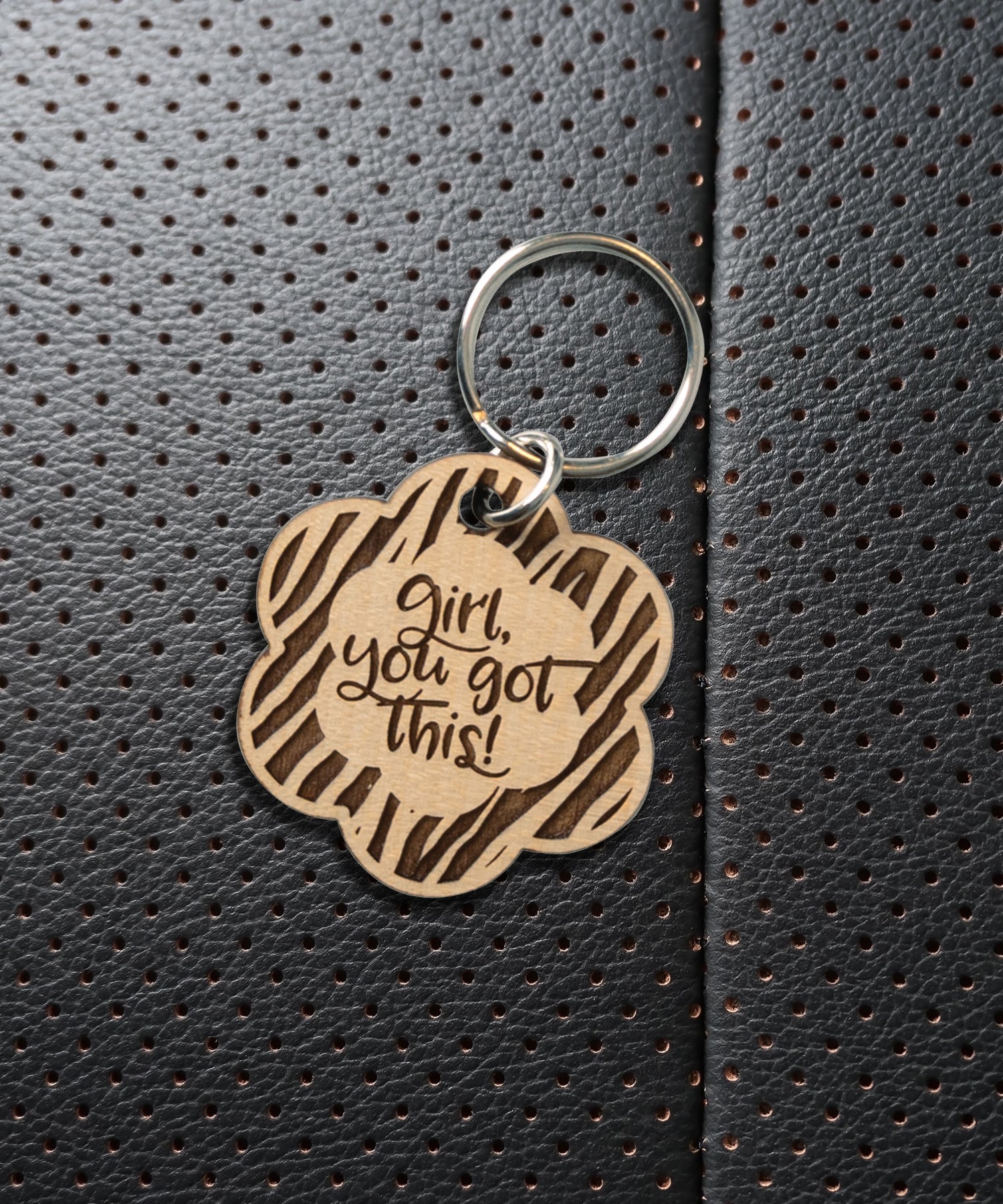Natural maple wood keychains have a laser-cut shape and laser-engraved Girl, You Got This verse.
