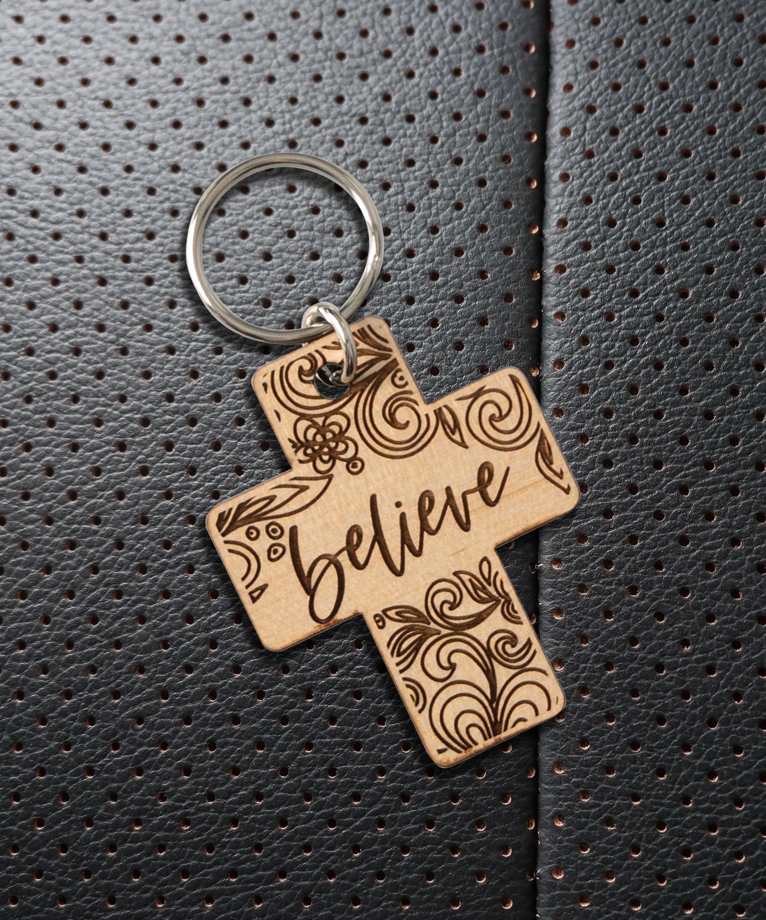 Natural maple wood keychains have a laser-cut shape and laser-engraved Believe verse.