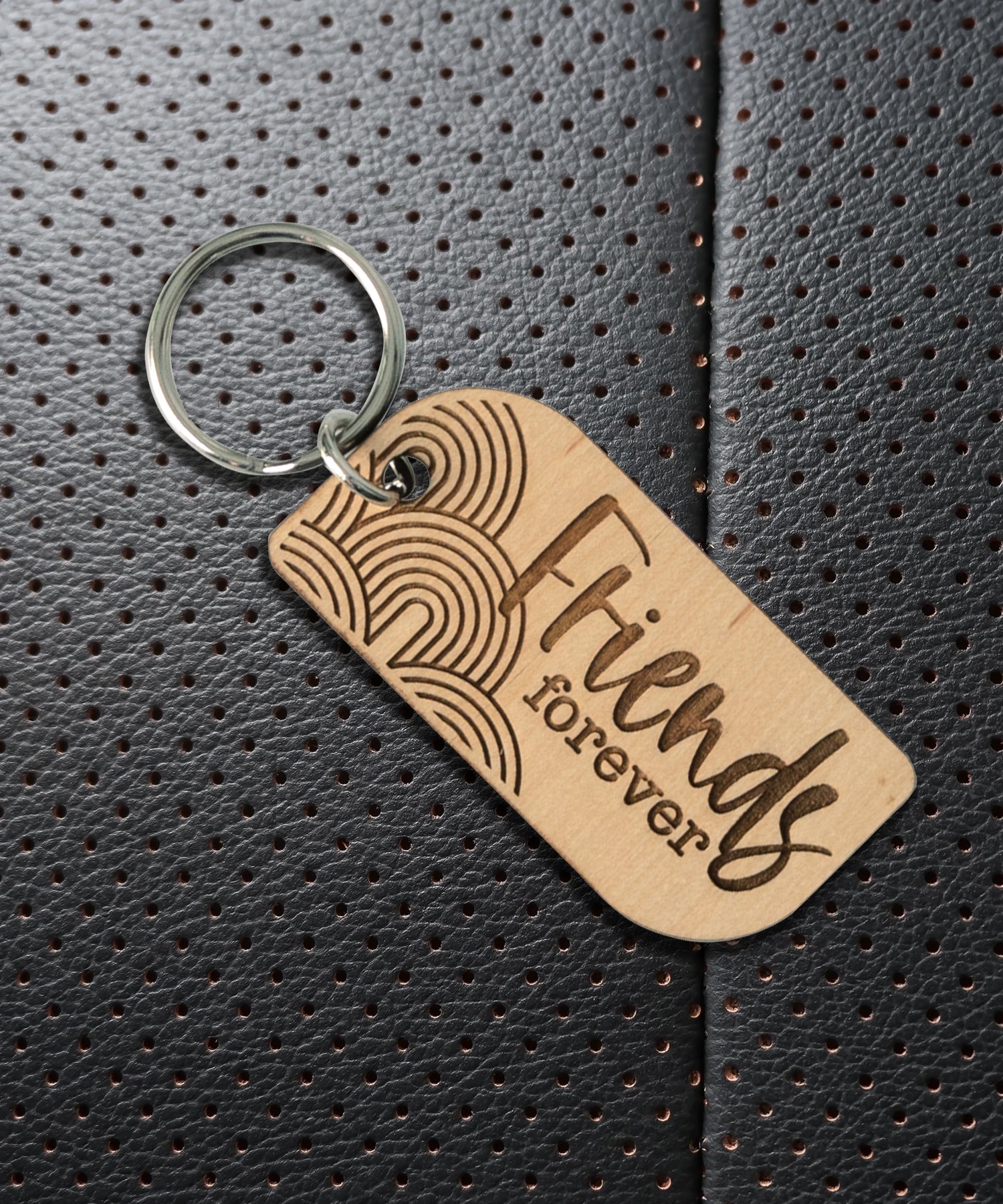 Natural maple wood keychains have a laser-cut shape and laser-engraved Friends Forever verse.