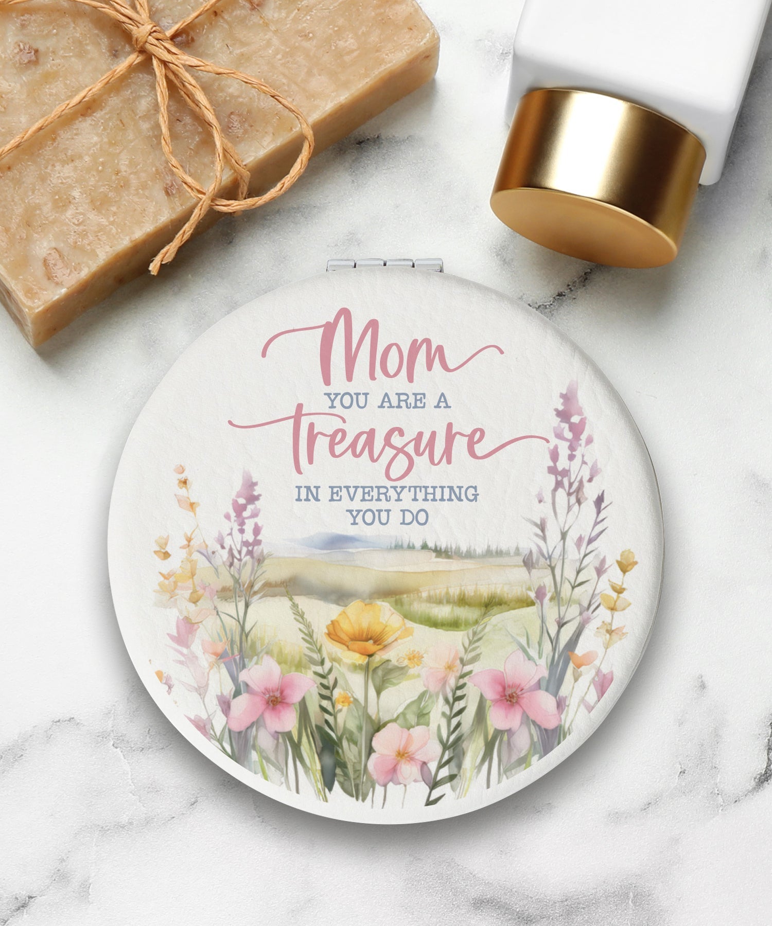 Round compact mirror with a leatherette cover, full-color “Mom” design, 1X and 2X mirrors inside, and magnetic closure.