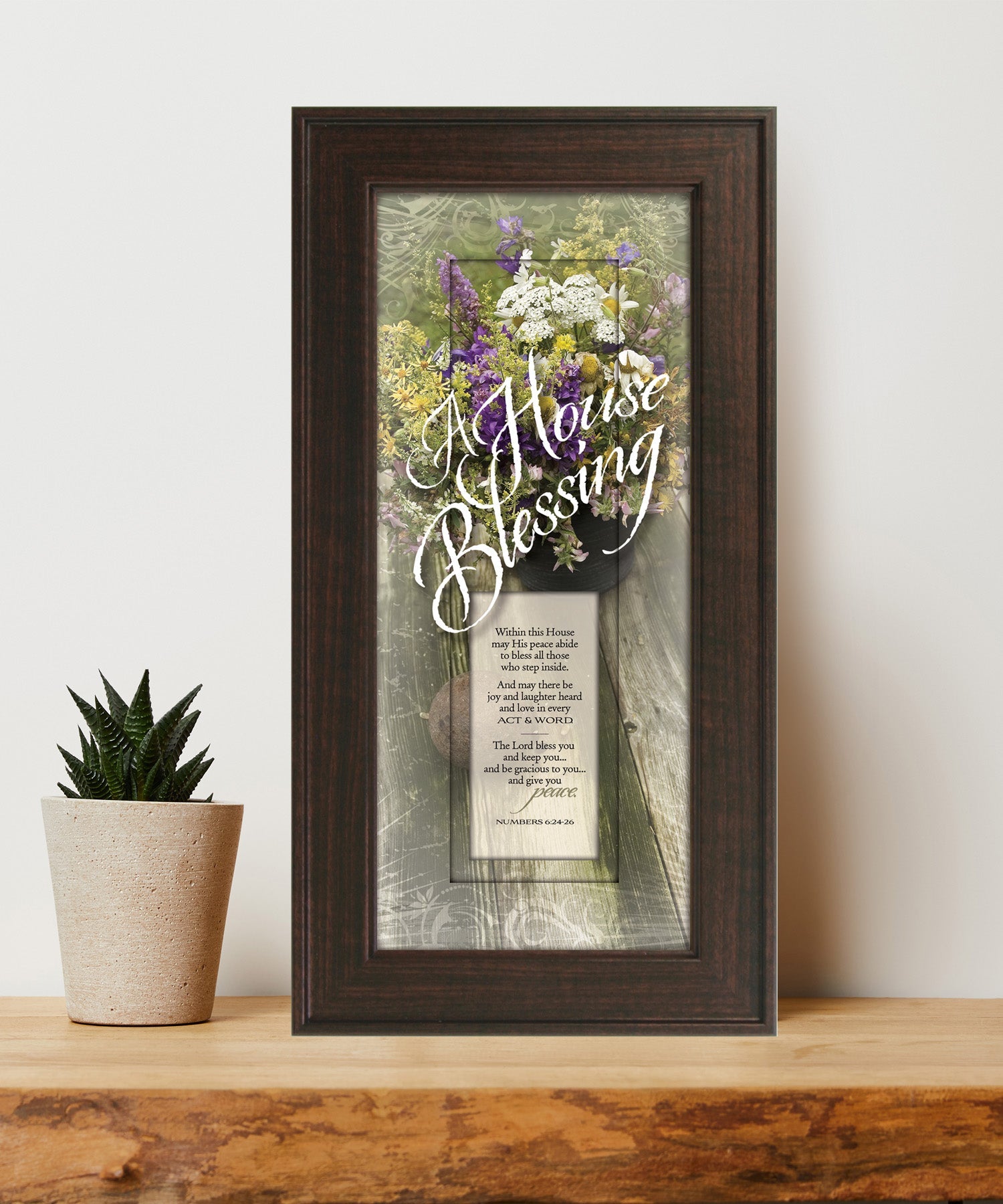 A House Blessing Framed Art with the inspirational quote is displayed prominently. The design includes elegant typography on a textured background, framed in a classic wood frame with a sophisticated finish.