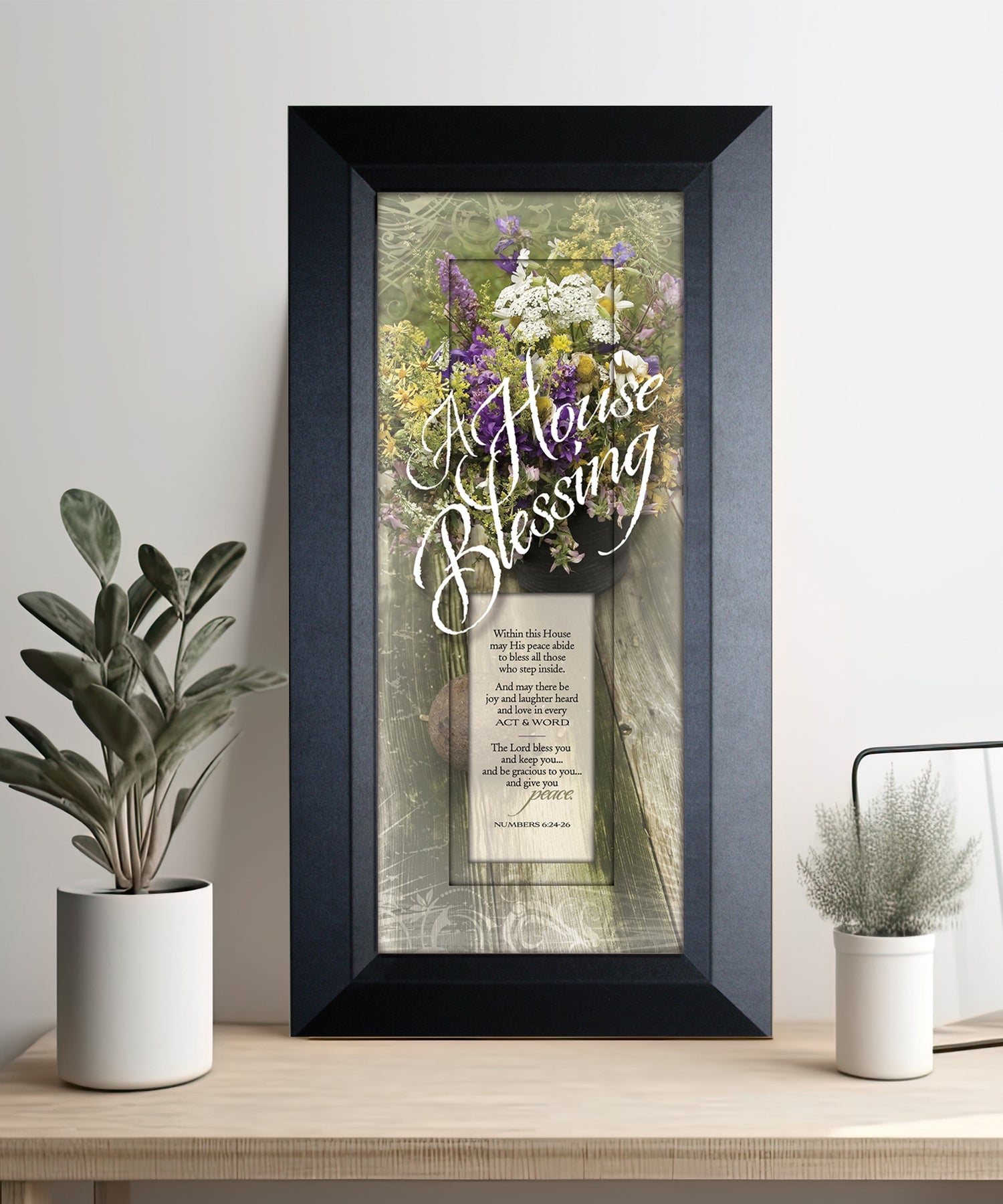 A House Blessing Framed Art with the inspirational quote is displayed prominently. The design includes elegant typography on a textured background, framed in a classic wood frame with a sophisticated finish.
