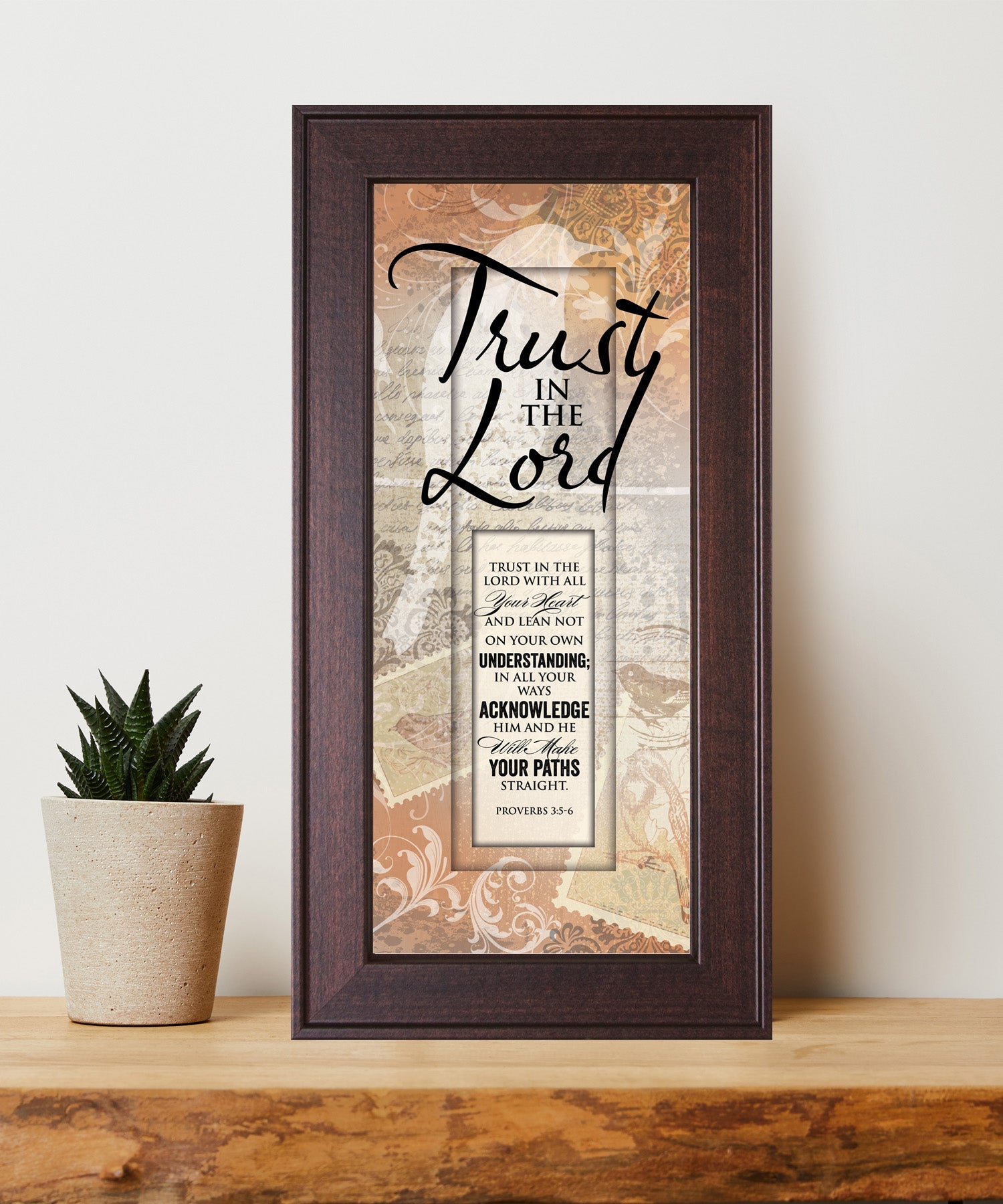 Trust in the Lord Framed Art with the inspirational quote displayed prominently. The design includes elegant typography on a textured background, framed in a classic wood frame with a sophisticated finish.