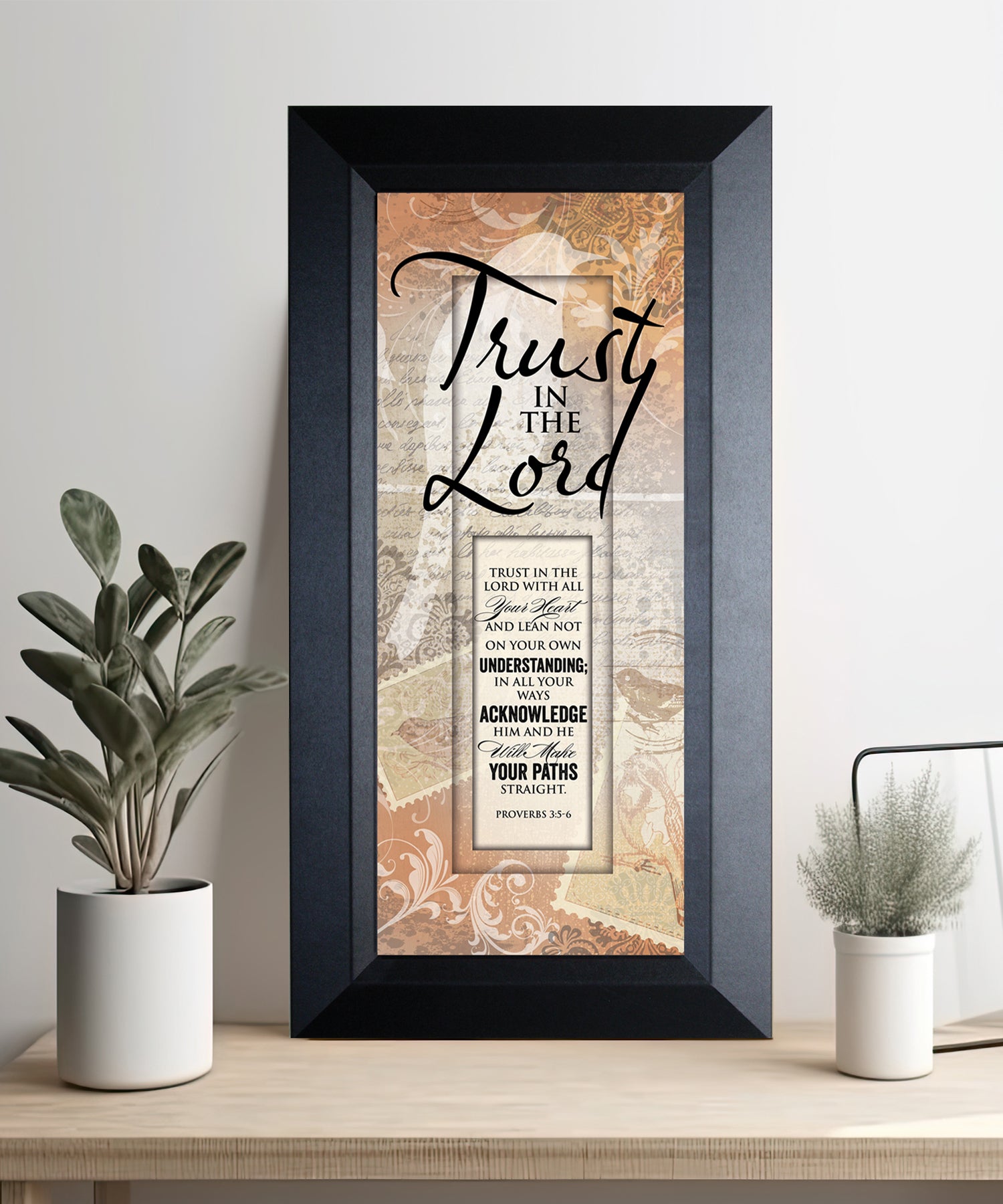 Trust in the Lord Framed Art with the inspirational quote displayed prominently. The design includes elegant typography on a textured background, framed in a classic wood frame with a sophisticated finish.