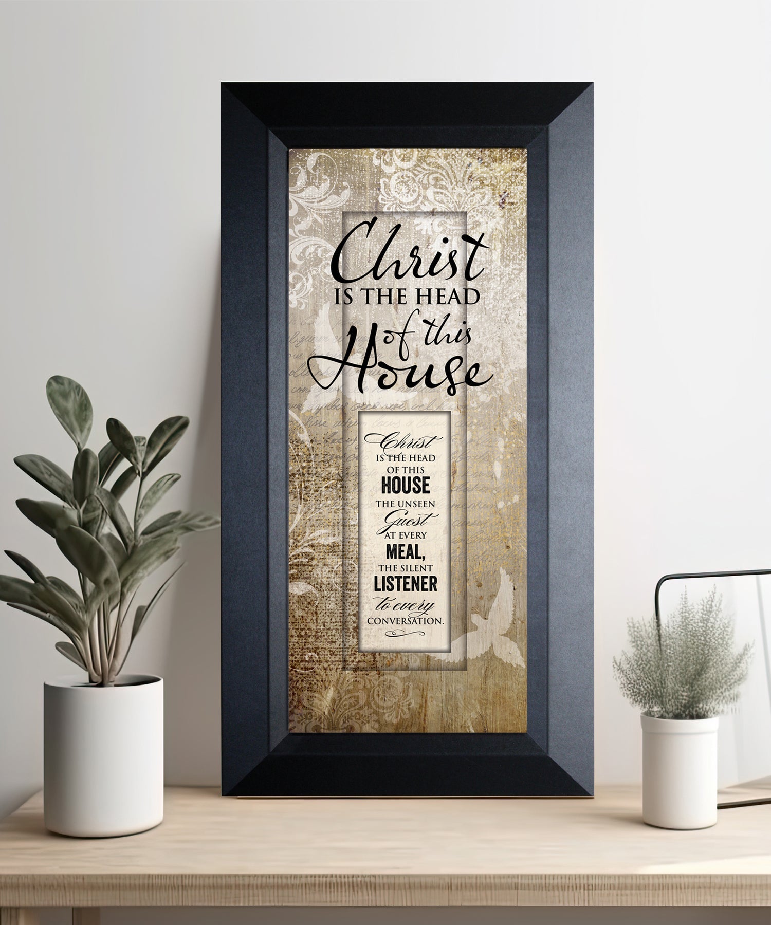 Christ Is the Head Framed Art with the inspirational quote is displayed prominently. The design includes elegant typography on a textured background, framed in a classic wood frame with a sophisticated finish.